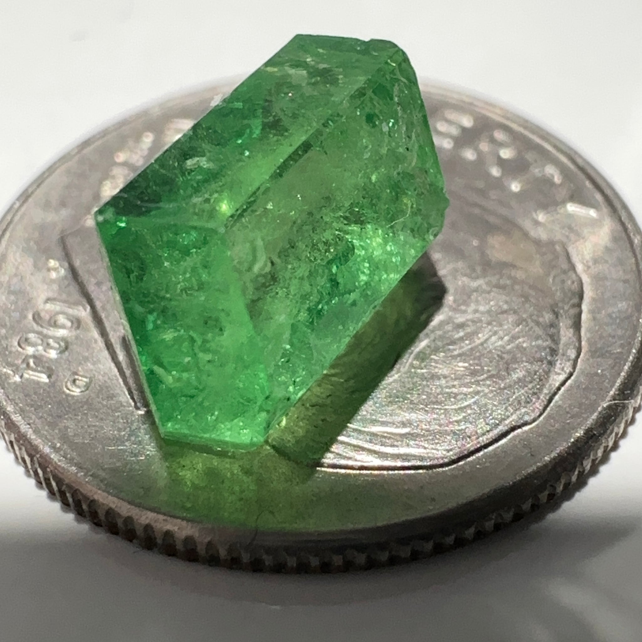 Tsavorite Garnet Crystal, 3.65ct A very unusual Tsavorite crystal from Merelani in Tanzania, Untreated Unheated, see the photos taken in different lights