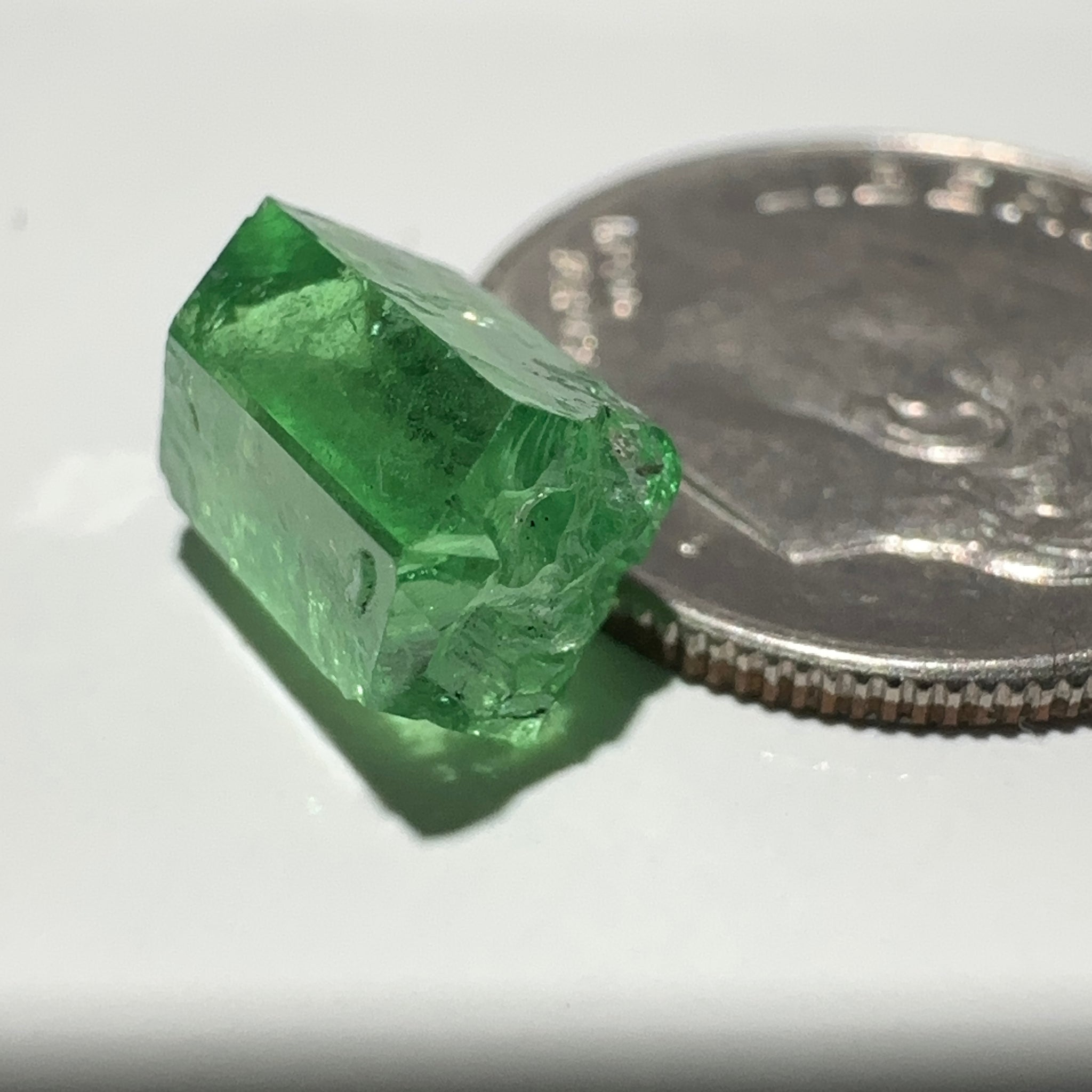 Tsavorite Garnet Crystal, 3.65ct A very unusual Tsavorite crystal from Merelani in Tanzania, Untreated Unheated, see the photos taken in different lights