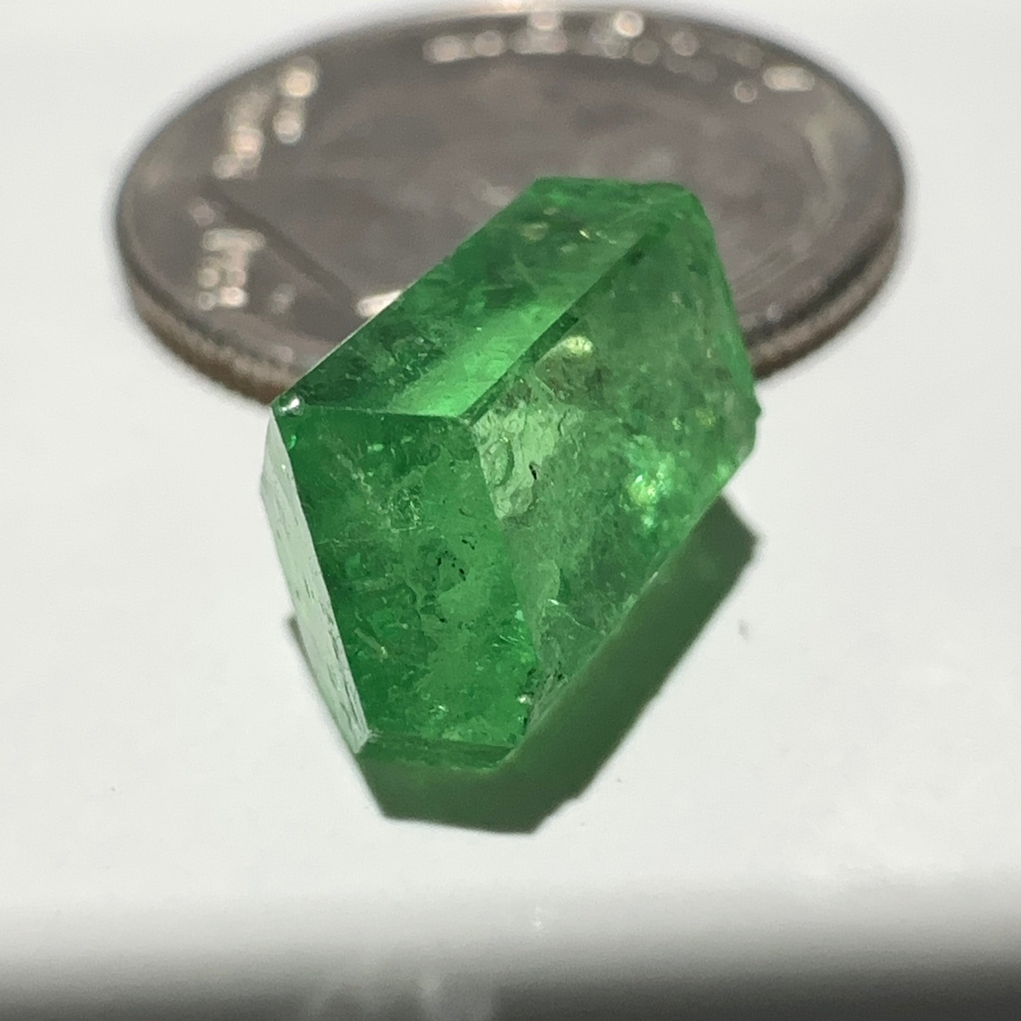 Tsavorite Garnet Crystal, 3.65ct A very unusual Tsavorite crystal from Merelani in Tanzania, Untreated Unheated, see the photos taken in different lights