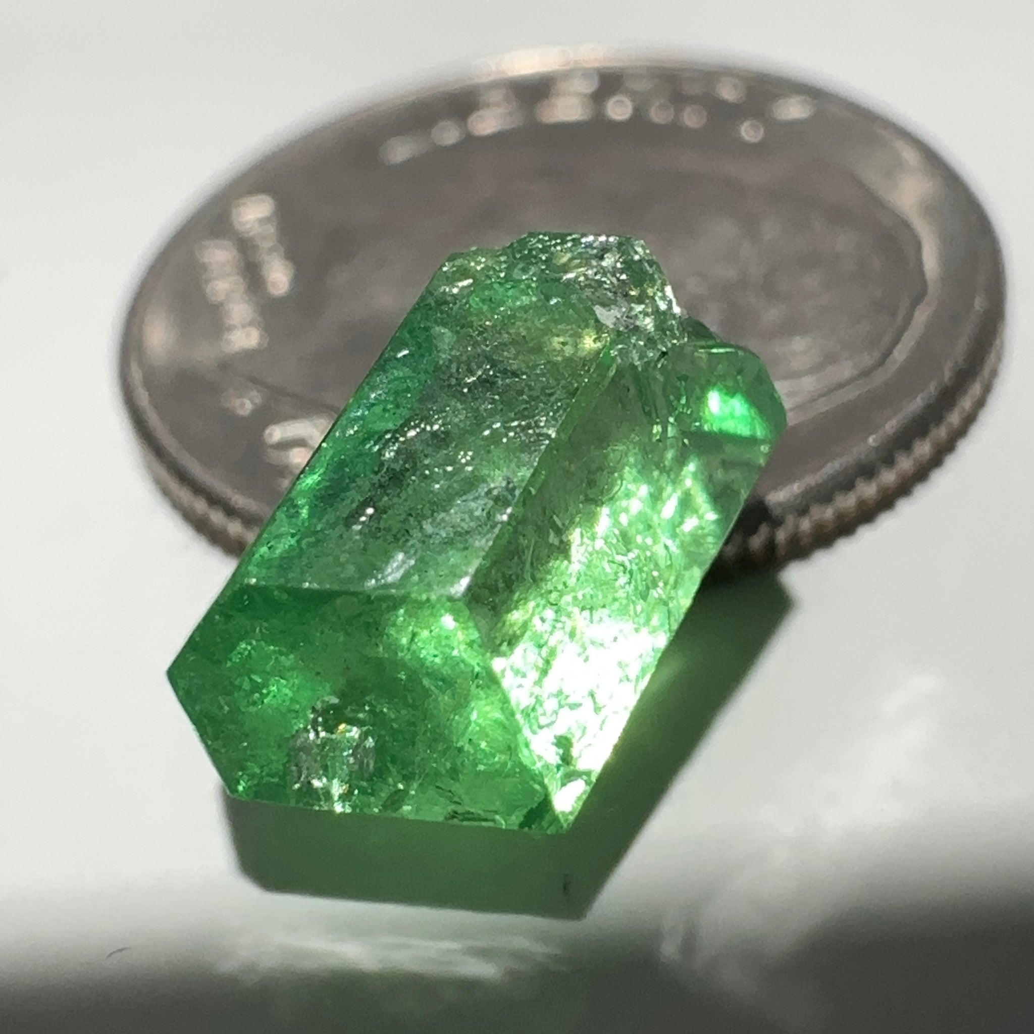 Tsavorite Garnet Crystal, 3.65ct A very unusual Tsavorite crystal from Merelani in Tanzania, Untreated Unheated, see the photos taken in different lights