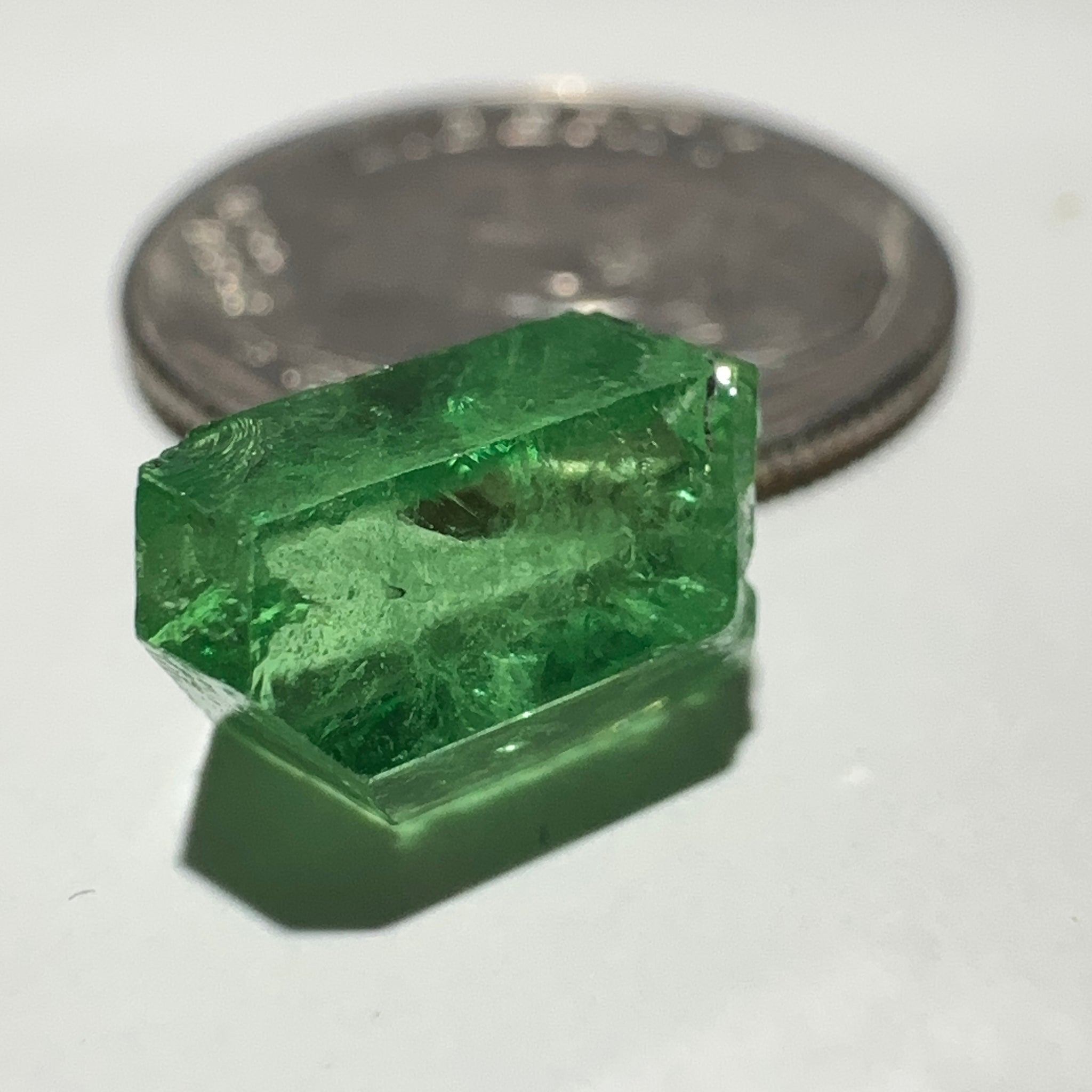 Tsavorite Garnet Crystal, 3.65ct A very unusual Tsavorite crystal from Merelani in Tanzania, Untreated Unheated, see the photos taken in different lights