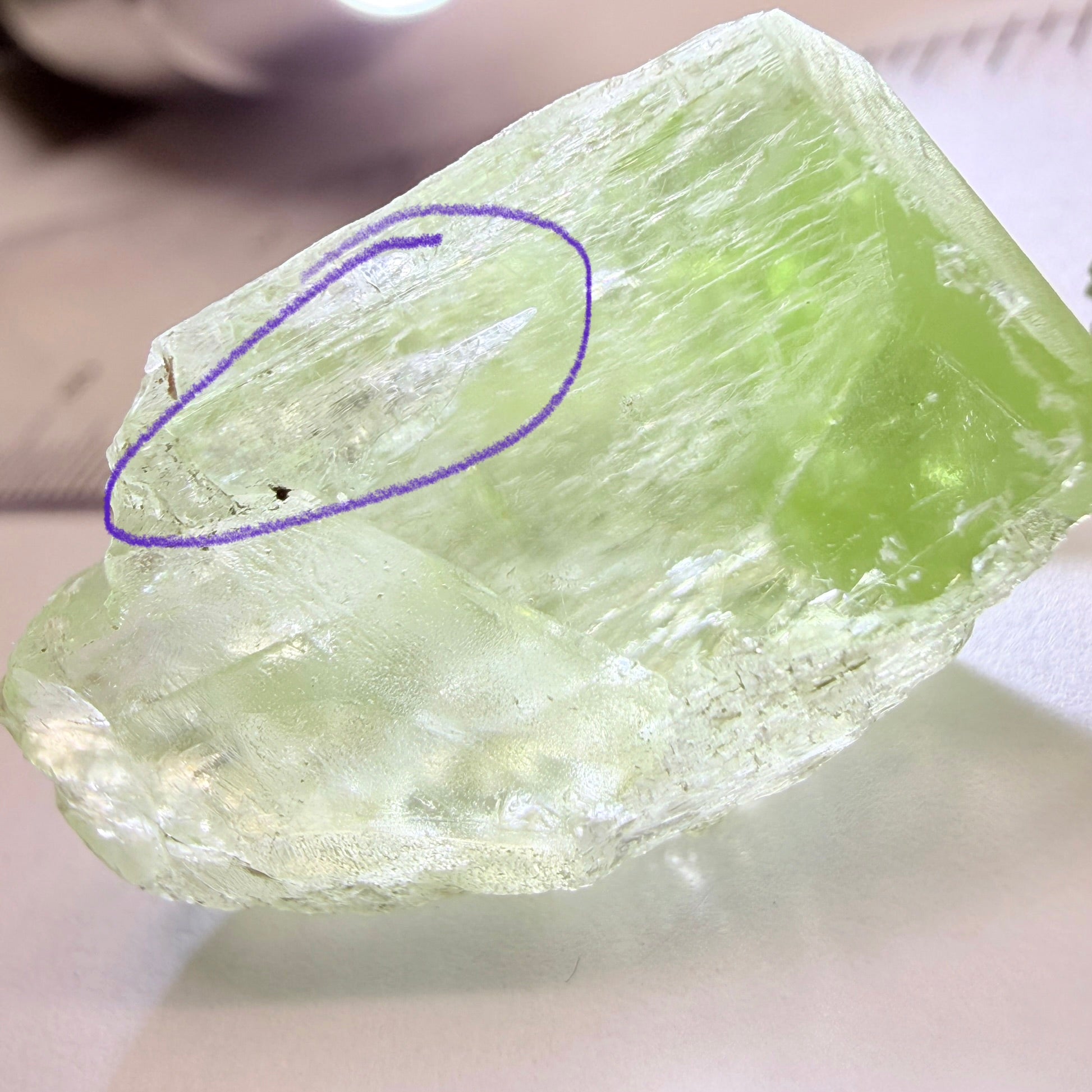 Diopside Crystal, 44.78ct, Merelani, Tanzania, Untreated Unheated,  with some fractures on the outside tip area protruding inwards, see pics I have circled the fracture area. Bulk of main center chunk clean vvs-if
