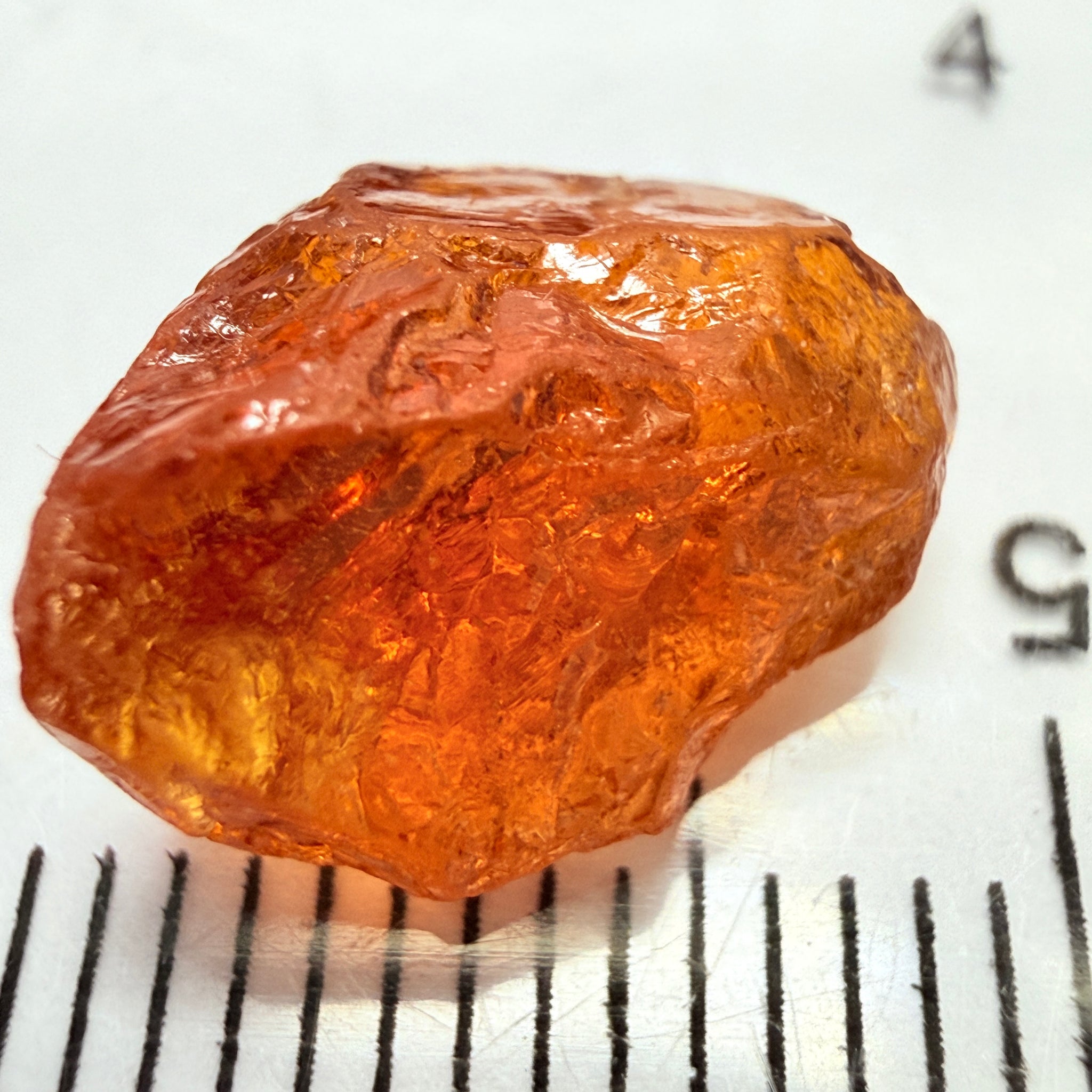 Mandarin Carrot Colour Spessartite Garnet, 5.51ct, Loliondo, Tanzania. Untreated Unheated. Slight crack on outside coming 2mm into stone, rest very slight sugar