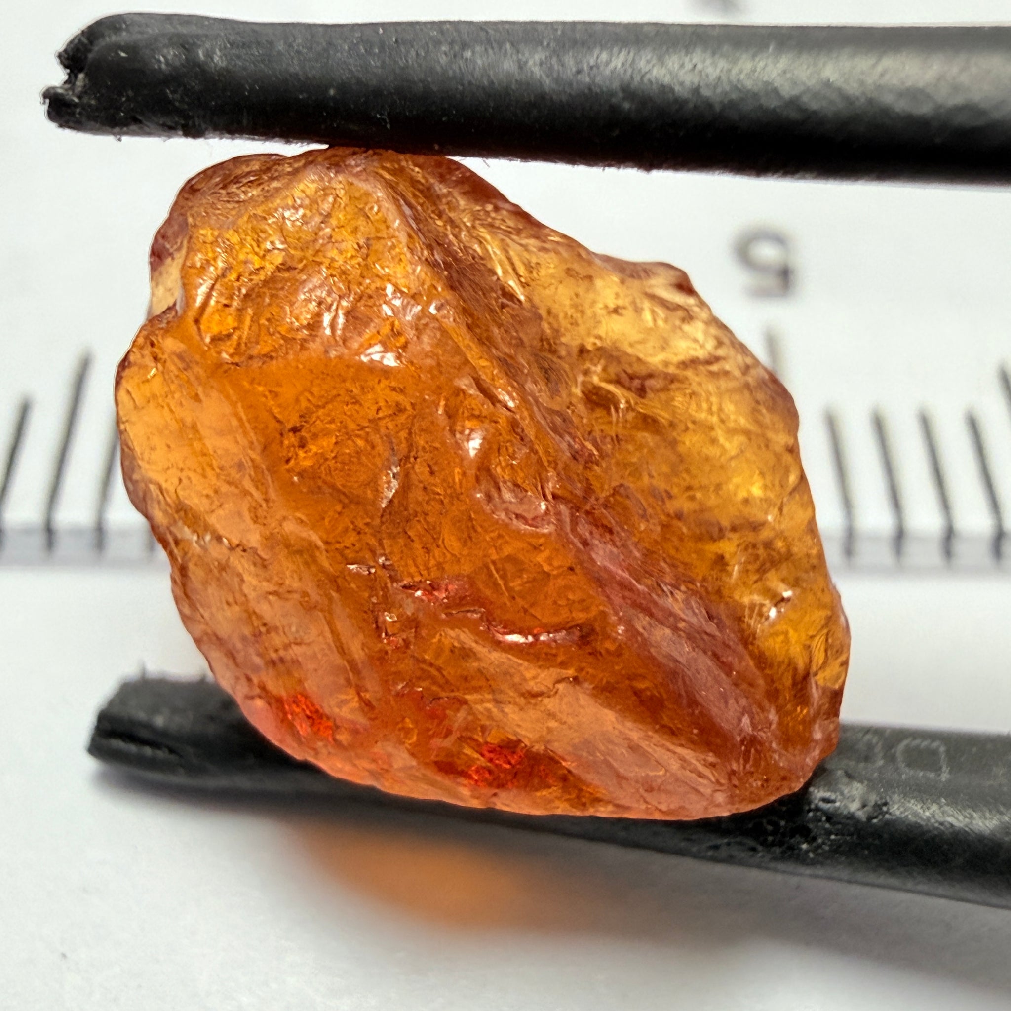 Mandarin Carrot Colour Spessartite Garnet, 5.51ct, Loliondo, Tanzania. Untreated Unheated. Slight crack on outside coming 2mm into stone, rest very slight sugar