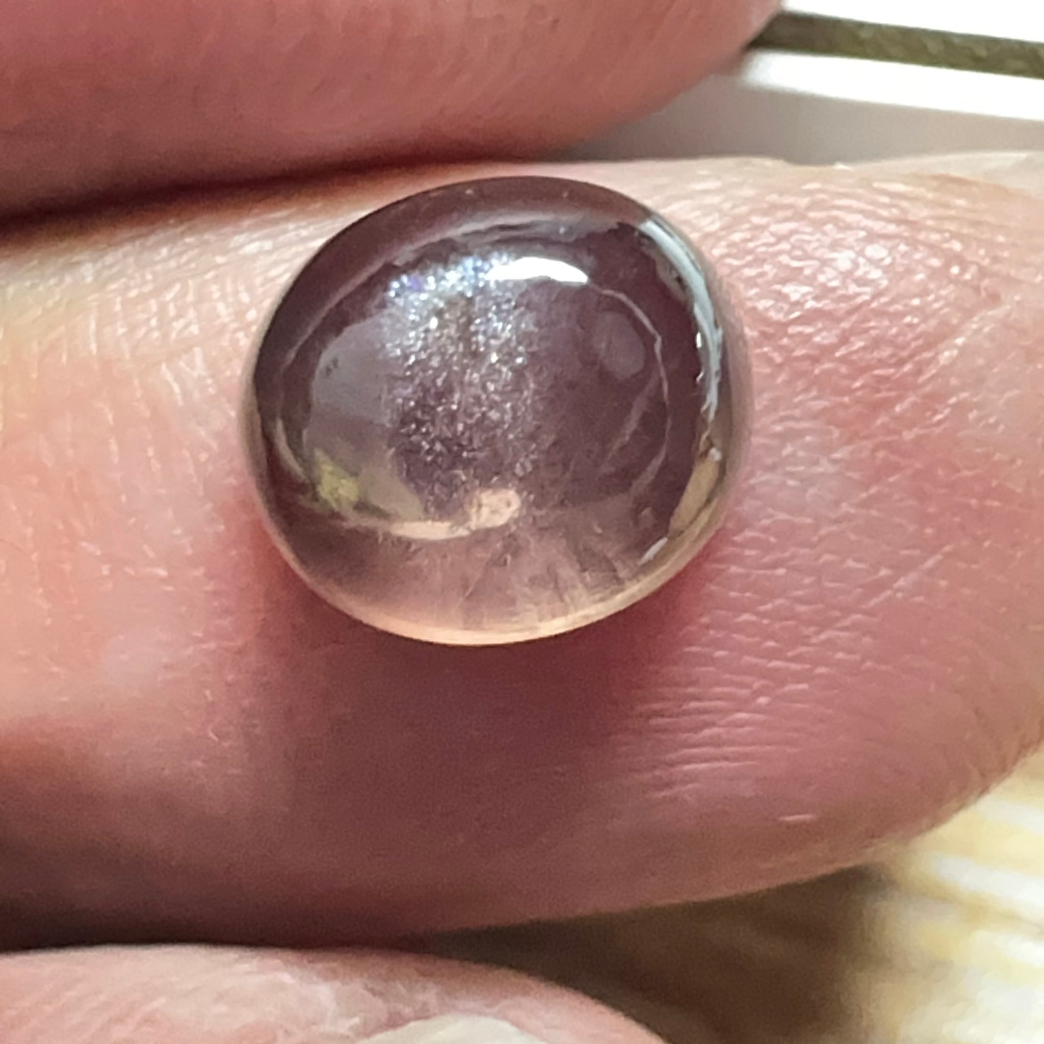 Colour Change Sapphire Cabochon, 3.52ct, Umba Valley, Tanzania. Untreated Unheated. Seems to have silk that appears as a moving spot