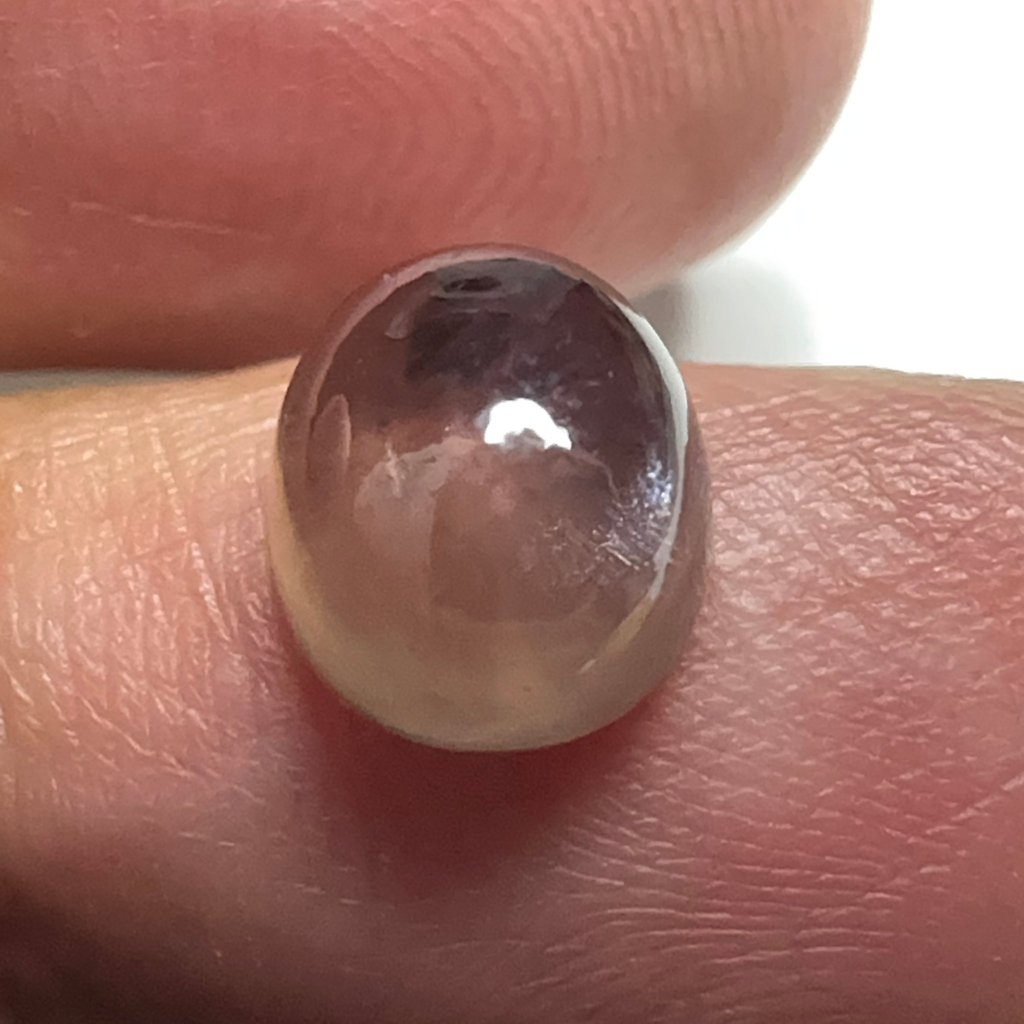 Colour Change Sapphire Cabochon, 3.52ct, Umba Valley, Tanzania. Untreated Unheated. Seems to have silk that appears as a moving spot