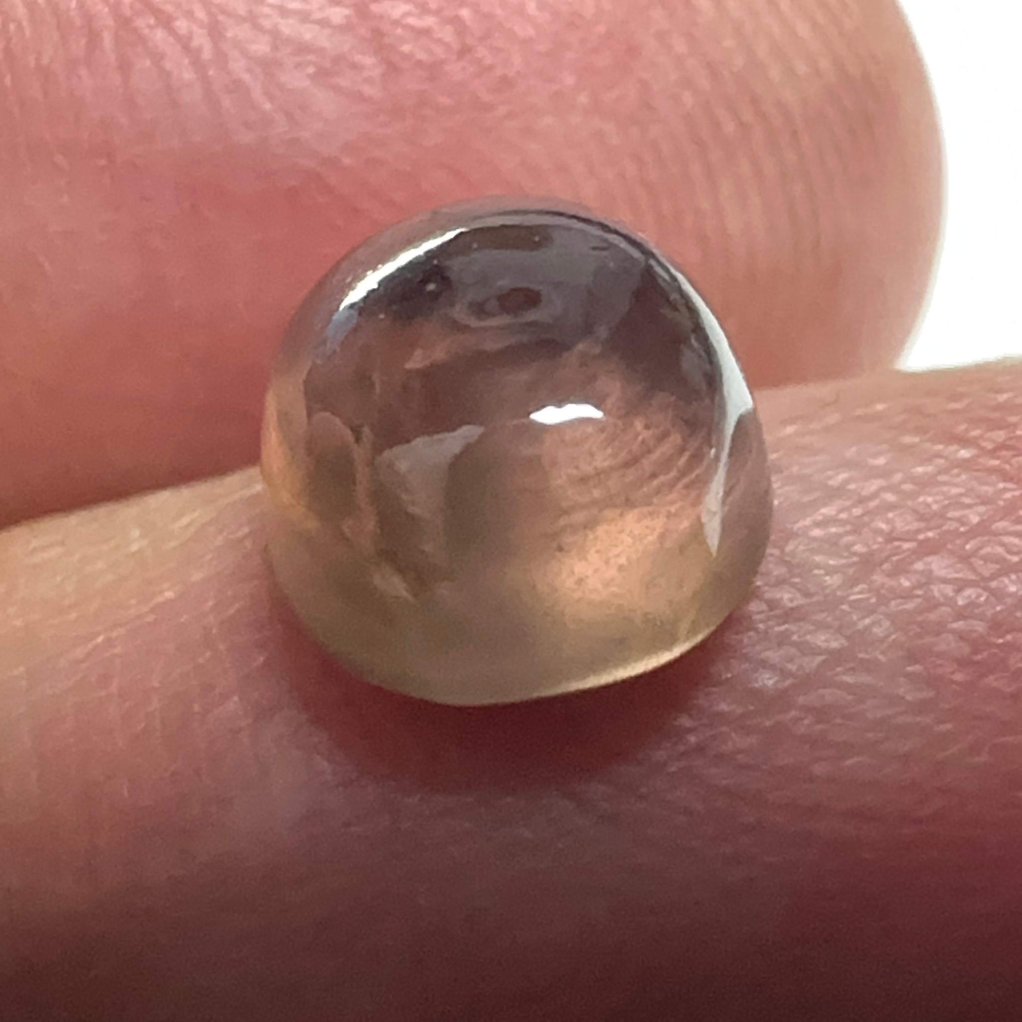 Colour Change Sapphire Cabochon, 3.52ct, Umba Valley, Tanzania. Untreated Unheated. Seems to have silk that appears as a moving spot