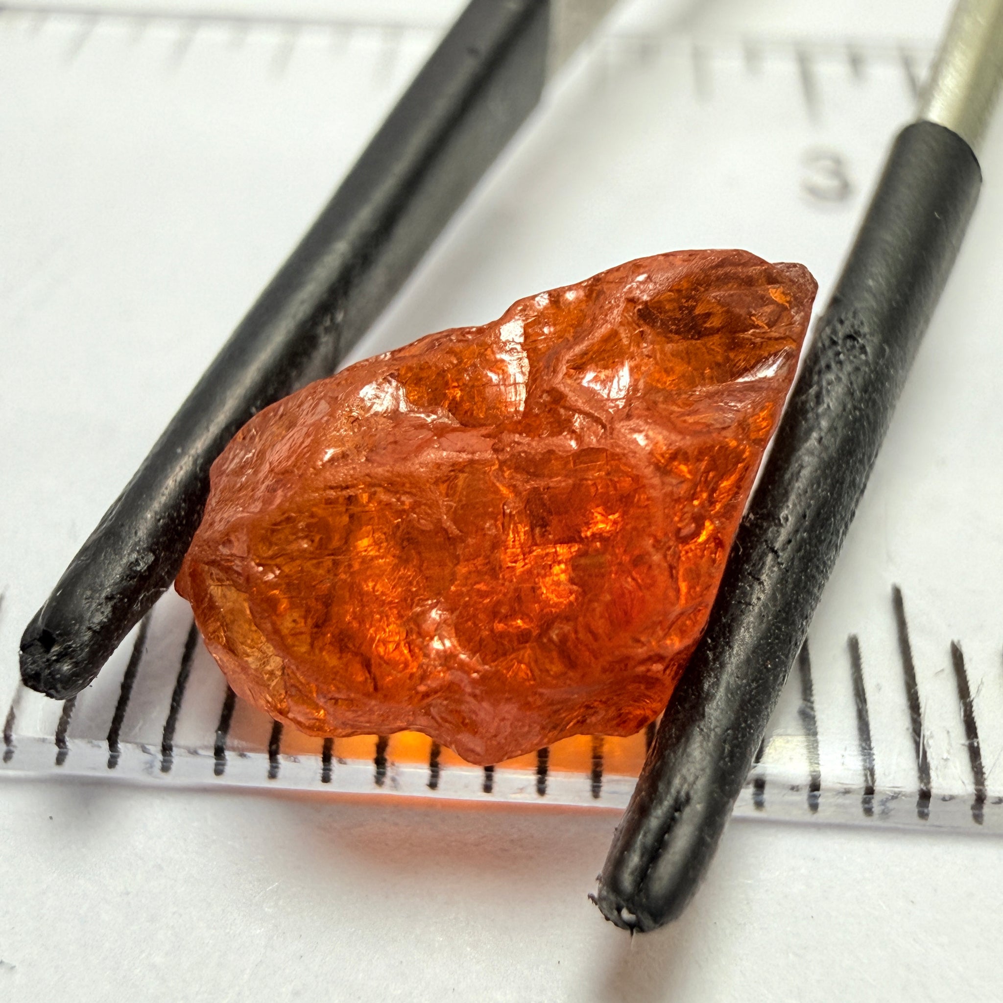 Mandarin Carrot Colour Spessartite Garnet, 5.51ct, Loliondo, Tanzania. Untreated Unheated. Slight crack on outside coming 2mm into stone, rest very slight sugar
