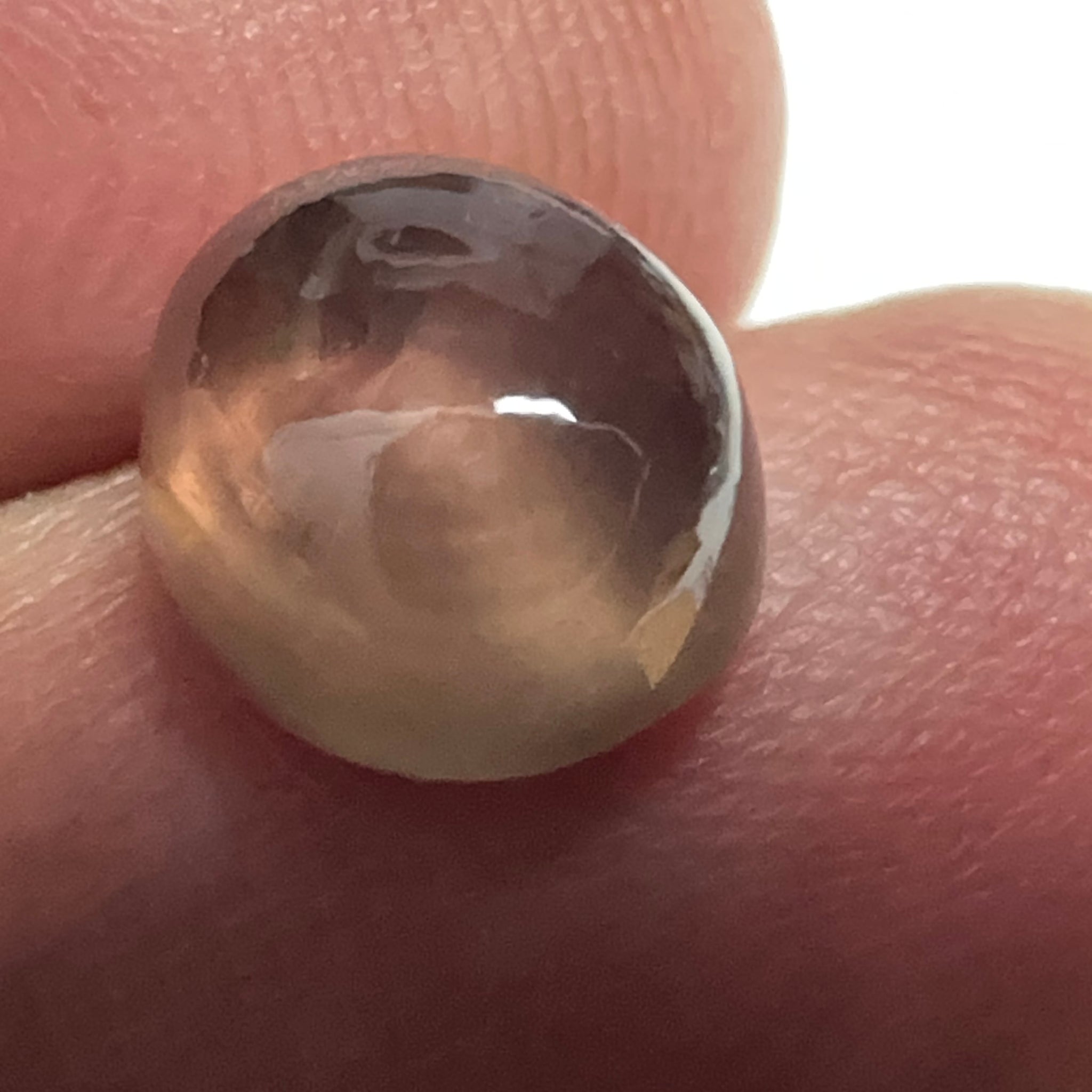 Colour Change Sapphire Cabochon, 3.52ct, Umba Valley, Tanzania. Untreated Unheated. Seems to have silk that appears as a moving spot