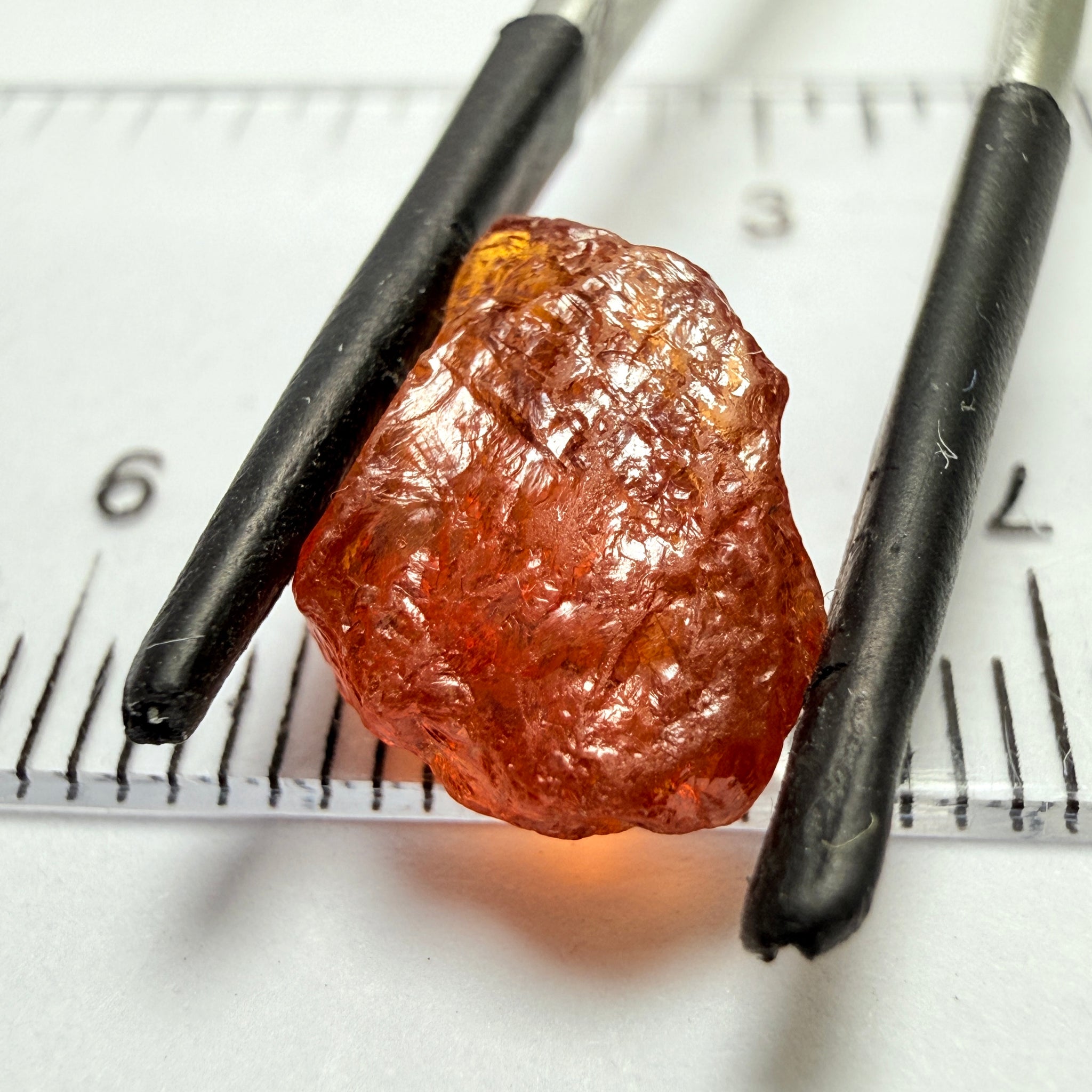 Mandarin Carrot Colour Spessartite Garnet, 5.51ct, Loliondo, Tanzania. Untreated Unheated. Slight crack on outside coming 2mm into stone, rest very slight sugar