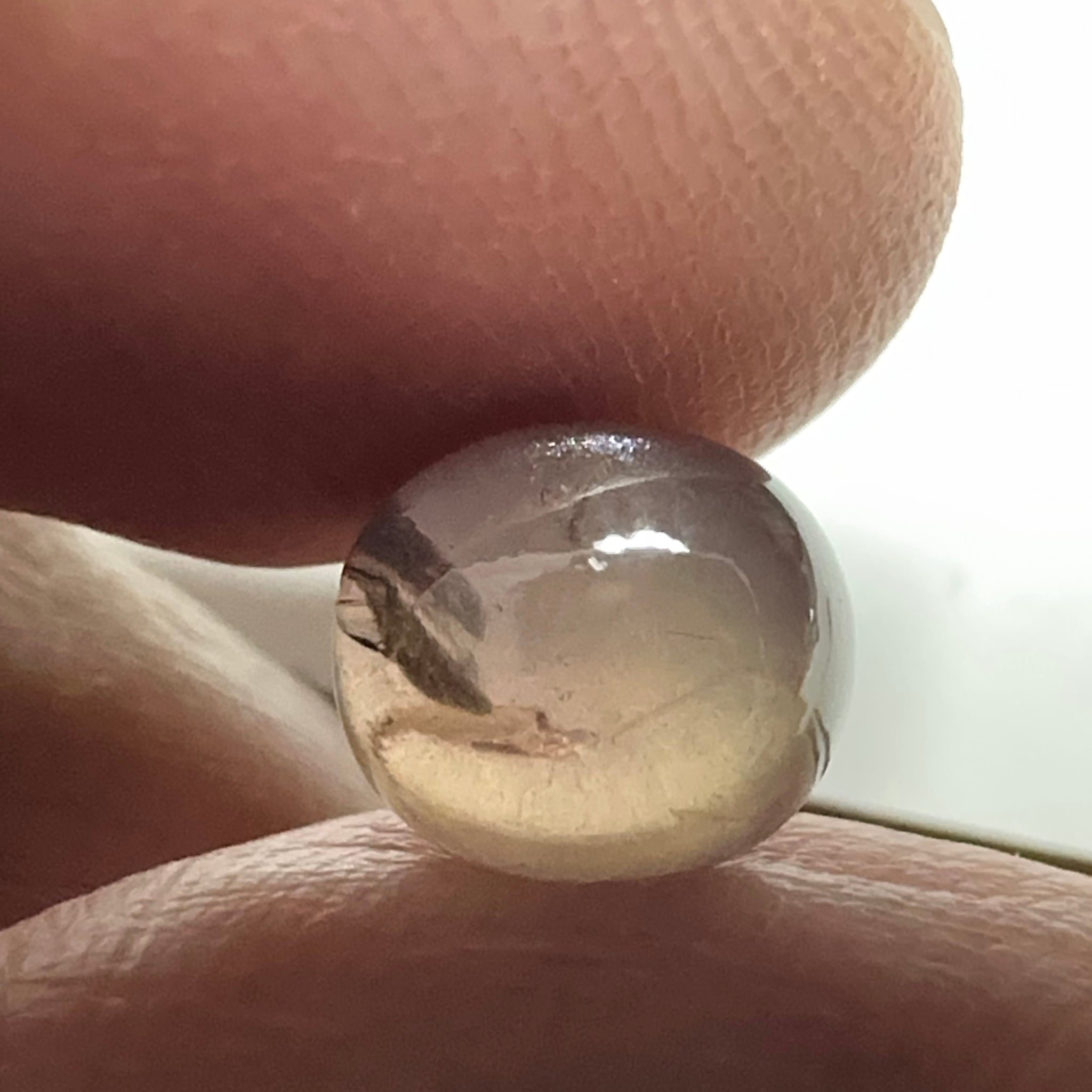 Colour Change Sapphire Cabochon, 3.52ct, Umba Valley, Tanzania. Untreated Unheated. Seems to have silk that appears as a moving spot