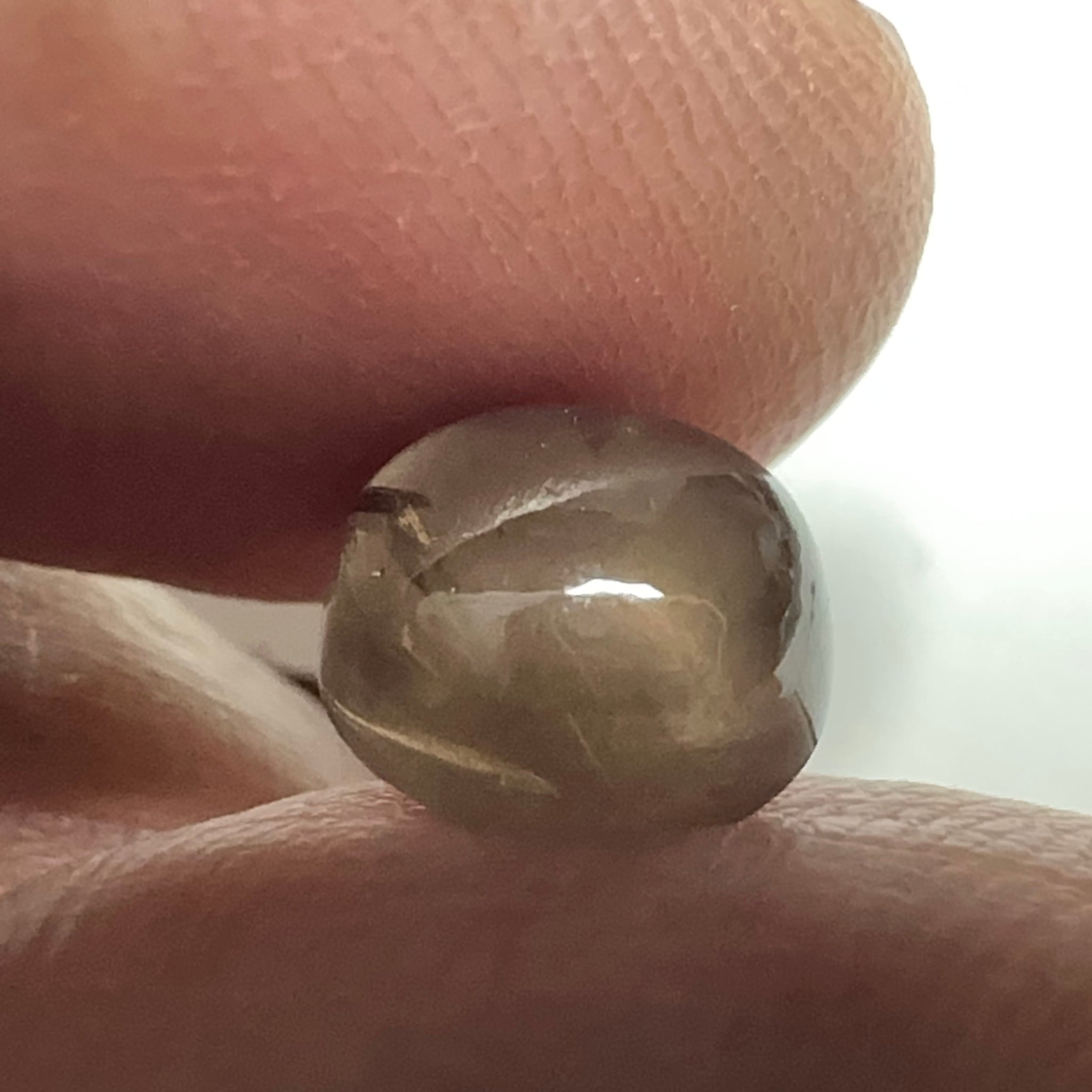 Colour Change Sapphire Cabochon, 3.52ct, Umba Valley, Tanzania. Untreated Unheated. Seems to have silk that appears as a moving spot