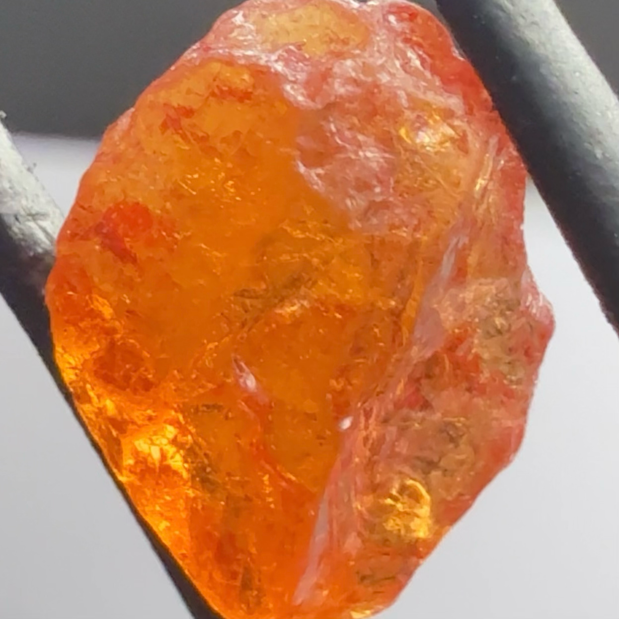 Mandarin Carrot Colour Spessartite Garnet, 5.51ct, Loliondo, Tanzania. Untreated Unheated. Slight crack on outside coming 2mm into stone, rest very slight sugar