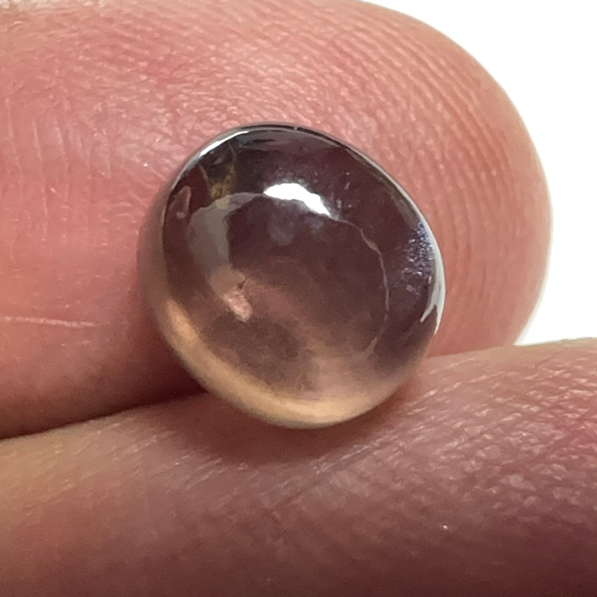 Colour Change Sapphire Cabochon, 3.52ct, Umba Valley, Tanzania. Untreated Unheated. Seems to have silk that appears as a moving spot