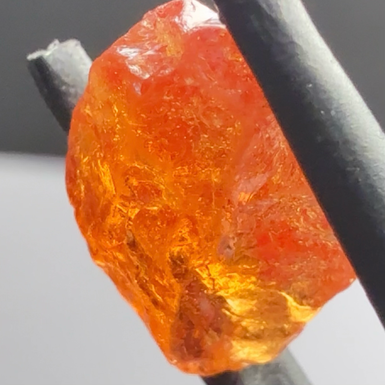 Mandarin Carrot Colour Spessartite Garnet, 5.51ct, Loliondo, Tanzania. Untreated Unheated. Slight crack on outside coming 2mm into stone, rest very slight sugar