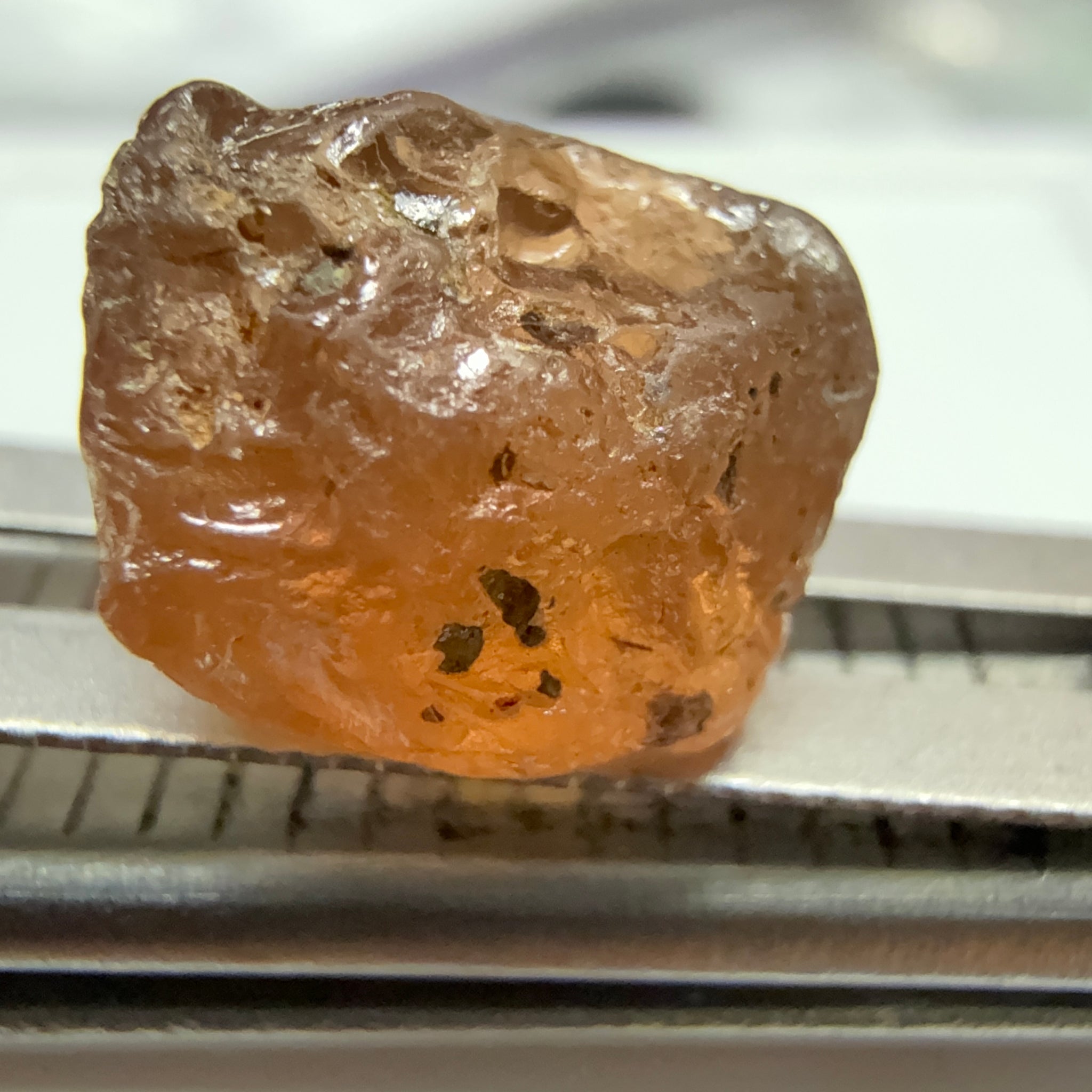 Peach Malaya Garnet, 6.02ct, slight crack 1mm inside from skin, slight gunk on skin on one end needs to be removed on disk, rest slightly silky, Unheated Untreated, Umba Valley Tanzania