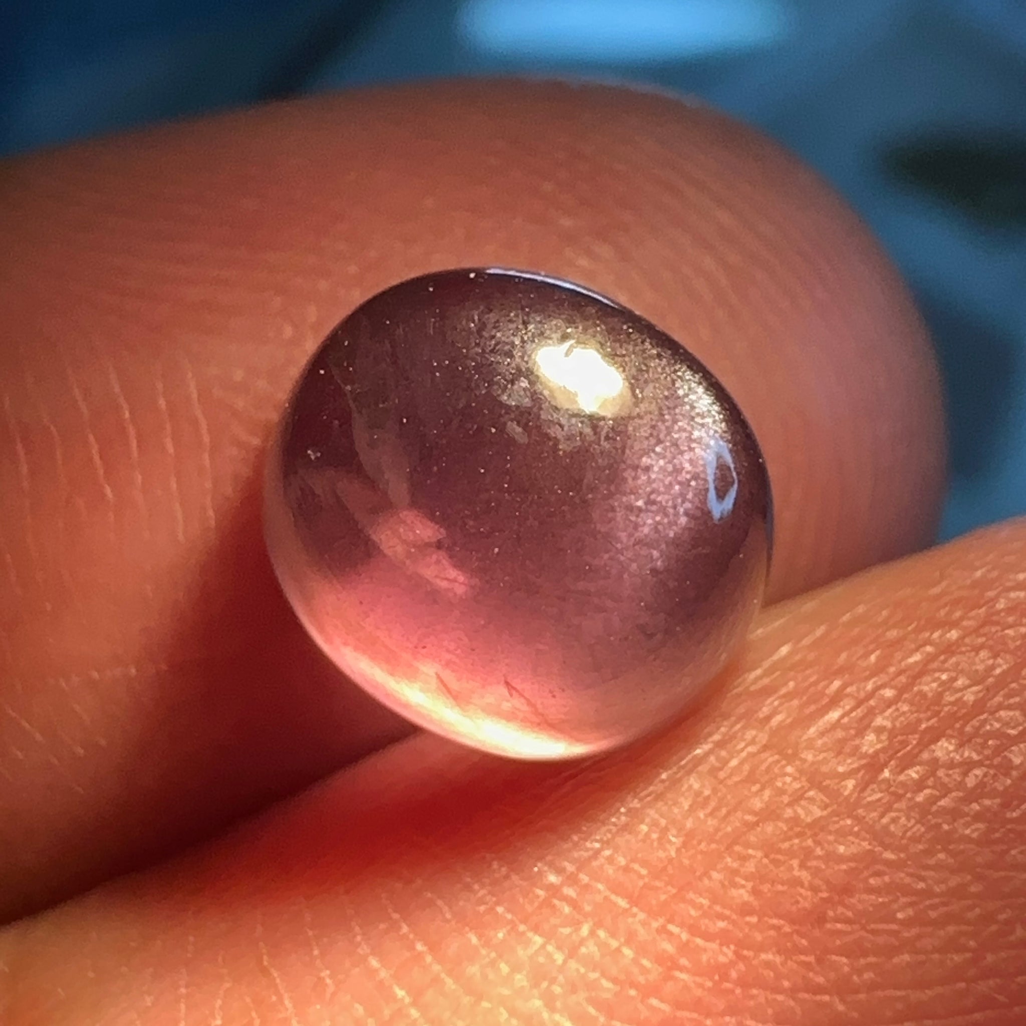 Colour Change Sapphire Cabochon, 3.52ct, Umba Valley, Tanzania. Untreated Unheated. Seems to have silk that appears as a moving spot