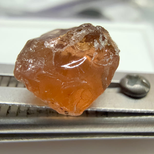 Peach Malaya Garnet, 6.02ct, slight crack 1mm inside from skin, slight gunk on skin on one end needs to be removed on disk, rest slightly silky, Unheated Untreated, Umba Valley Tanzania