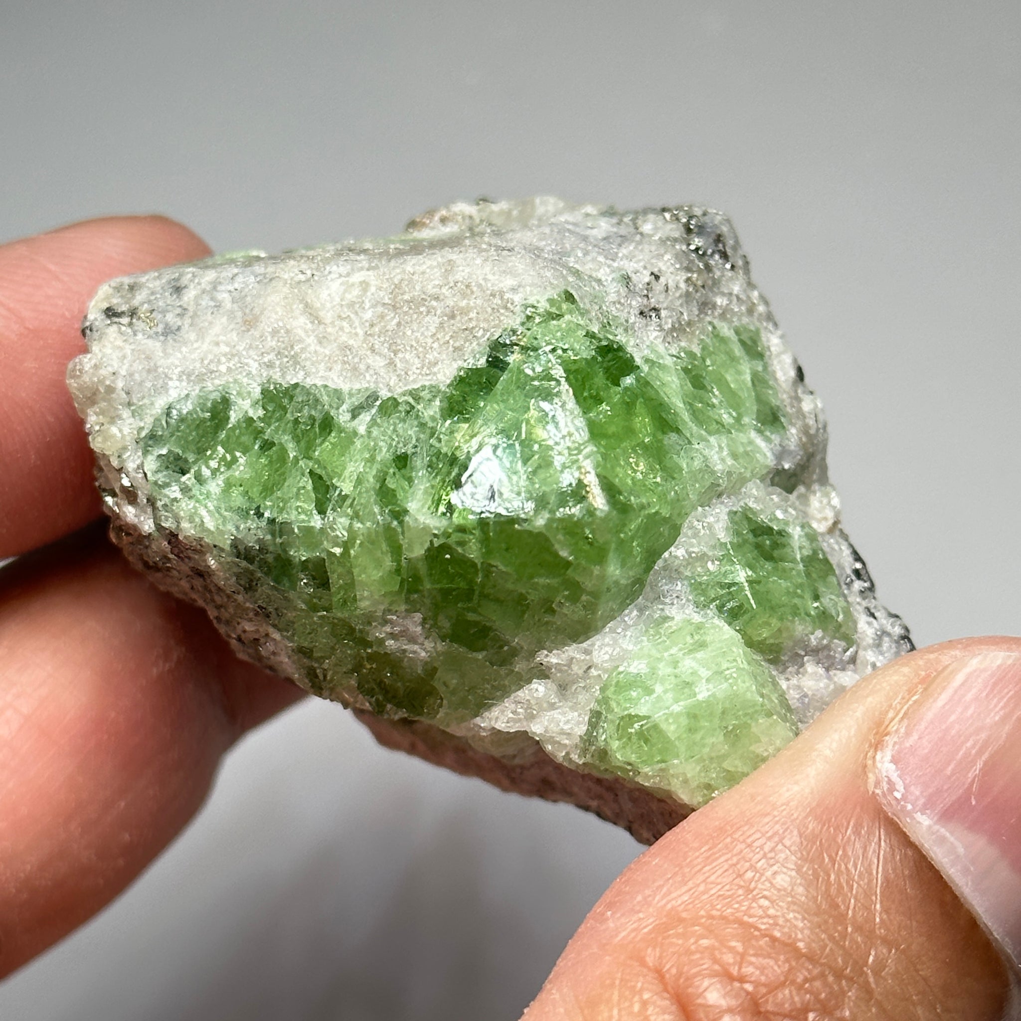 Tsavorite Crystal With Tanzanite And Pyrite on Matrix, 84.30gm / 421.50ct, Merelani, Tanzania. 47 x 36 x 39mm Gem portions and sharp point on crystals
