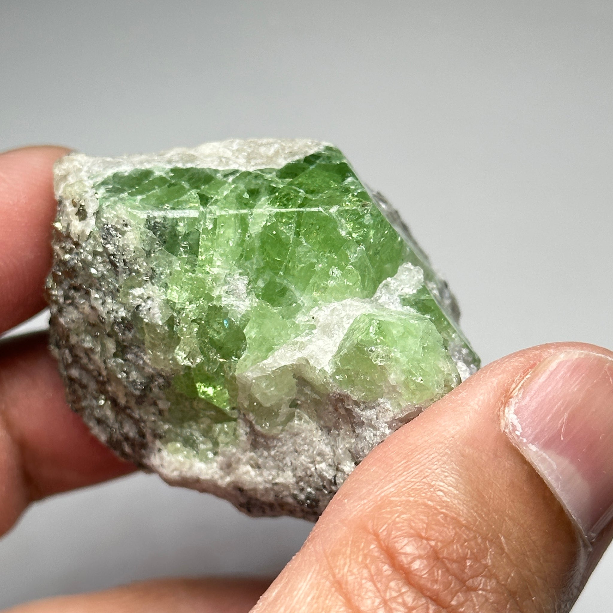 Tsavorite Crystal With Tanzanite And Pyrite on Matrix, 84.30gm / 421.50ct, Merelani, Tanzania. 47 x 36 x 39mm Gem portions and sharp point on crystals