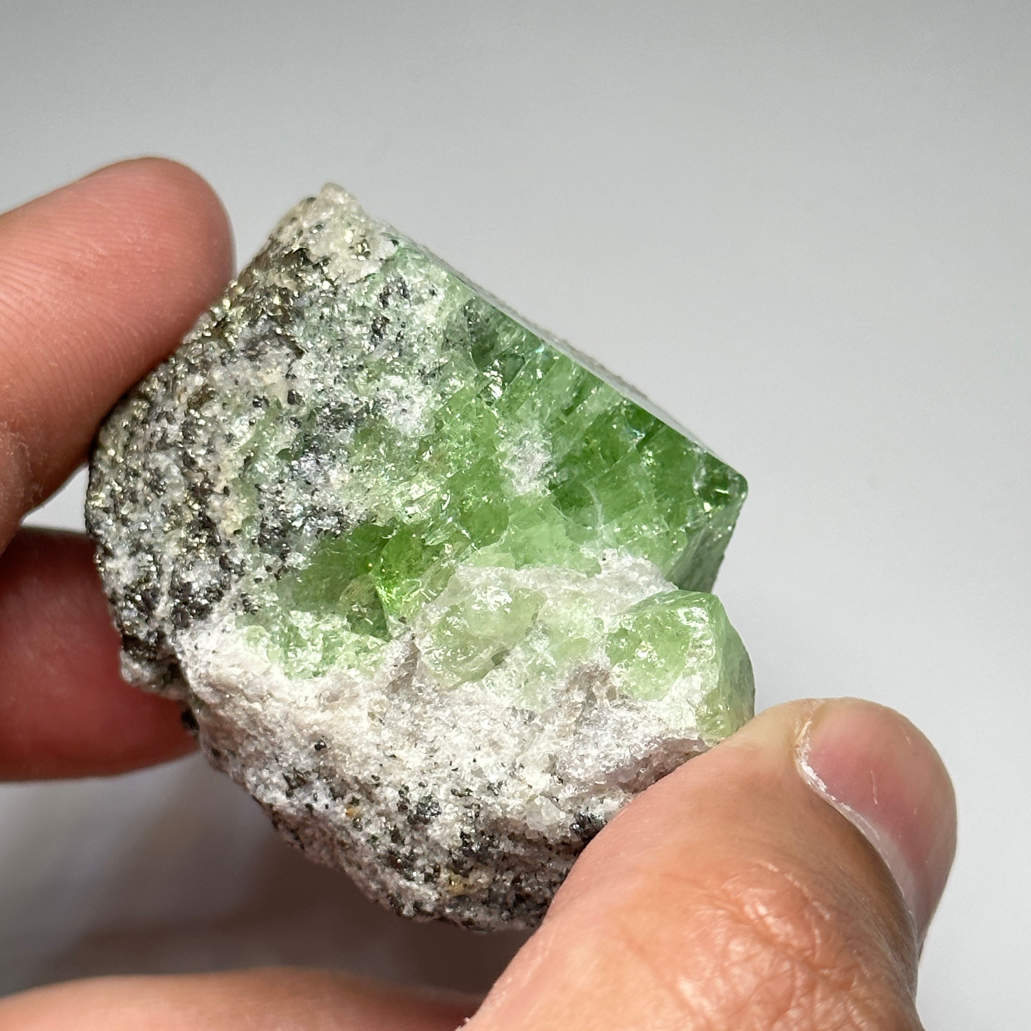 Tsavorite Crystal With Tanzanite And Pyrite on Matrix, 84.30gm / 421.50ct, Merelani, Tanzania. 47 x 36 x 39mm Gem portions and sharp point on crystals