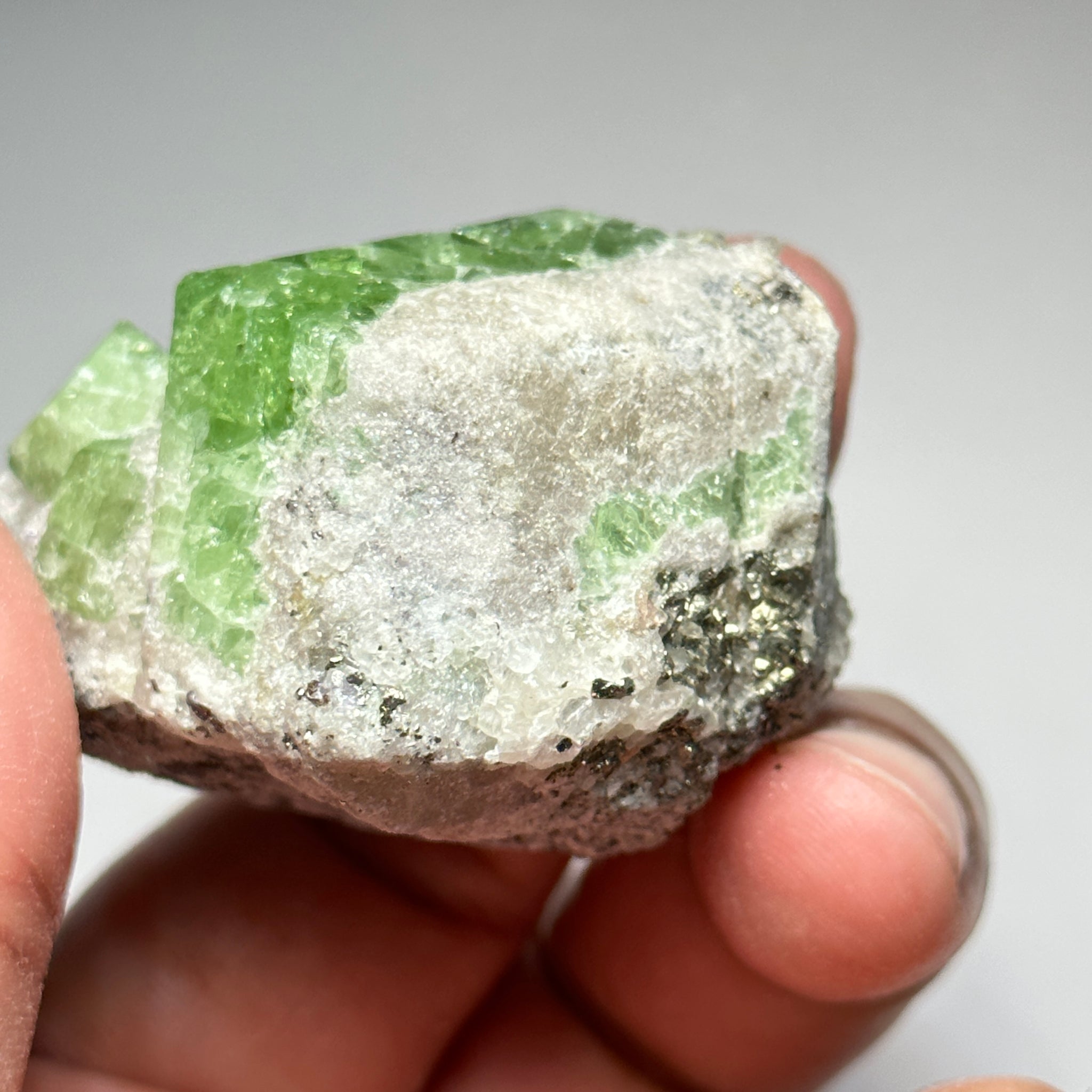 Tsavorite Crystal With Tanzanite And Pyrite on Matrix, 84.30gm / 421.50ct, Merelani, Tanzania. 47 x 36 x 39mm Gem portions and sharp point on crystals