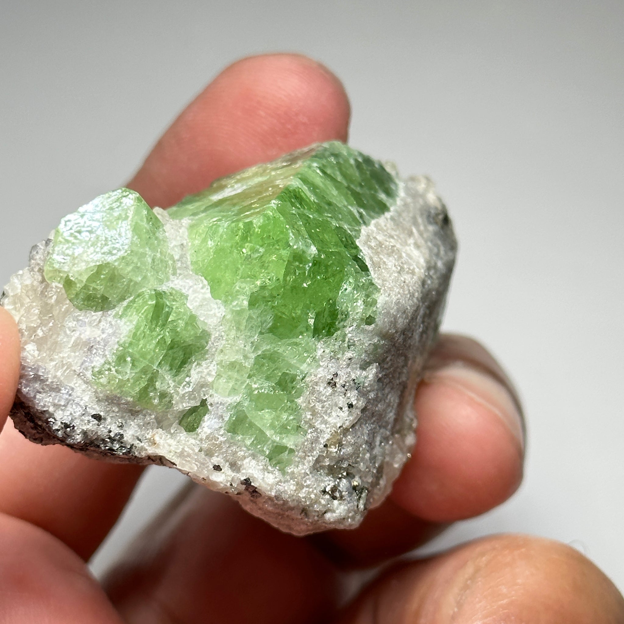 Tsavorite Crystal With Tanzanite And Pyrite on Matrix, 84.30gm / 421.50ct, Merelani, Tanzania. 47 x 36 x 39mm Gem portions and sharp point on crystals