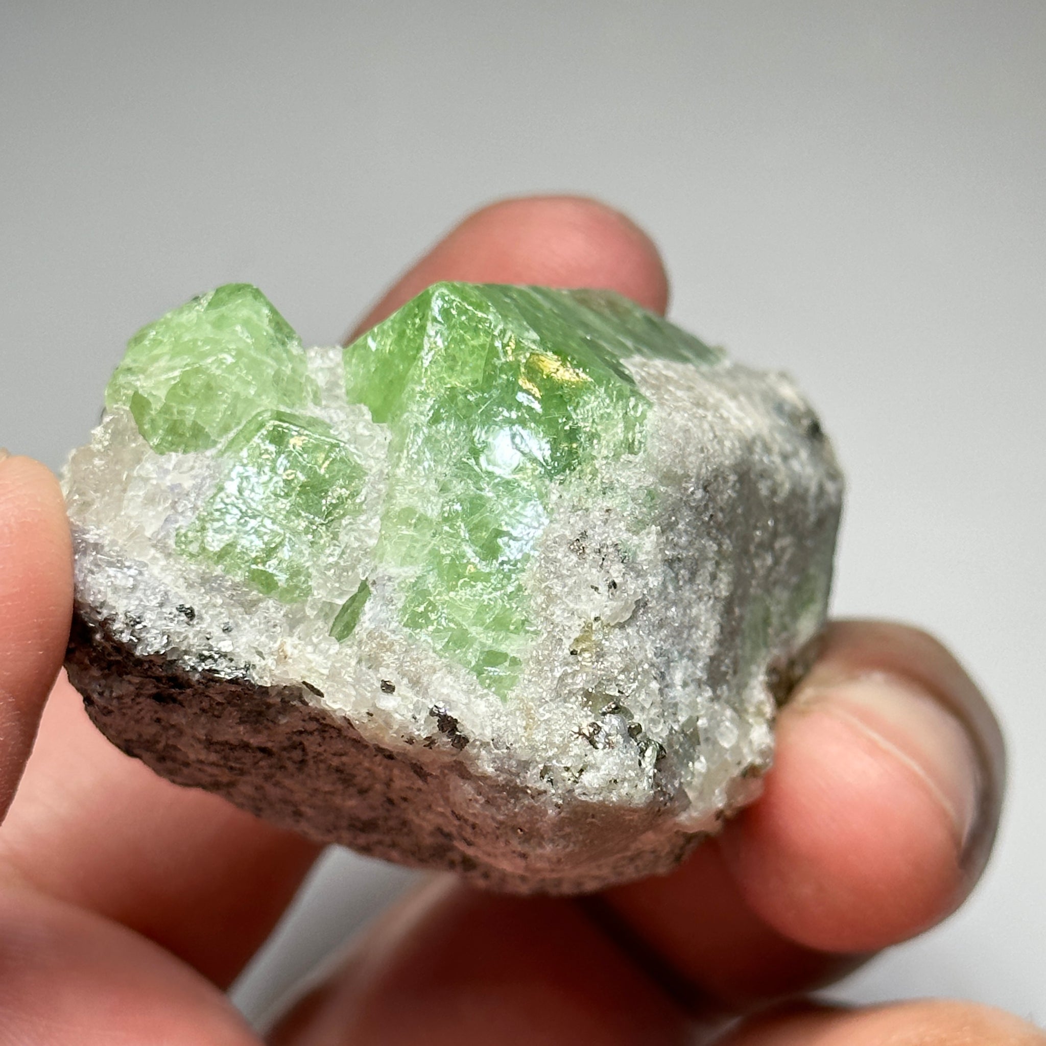 Tsavorite Crystal With Tanzanite And Pyrite on Matrix, 84.30gm / 421.50ct, Merelani, Tanzania. 47 x 36 x 39mm Gem portions and sharp point on crystals