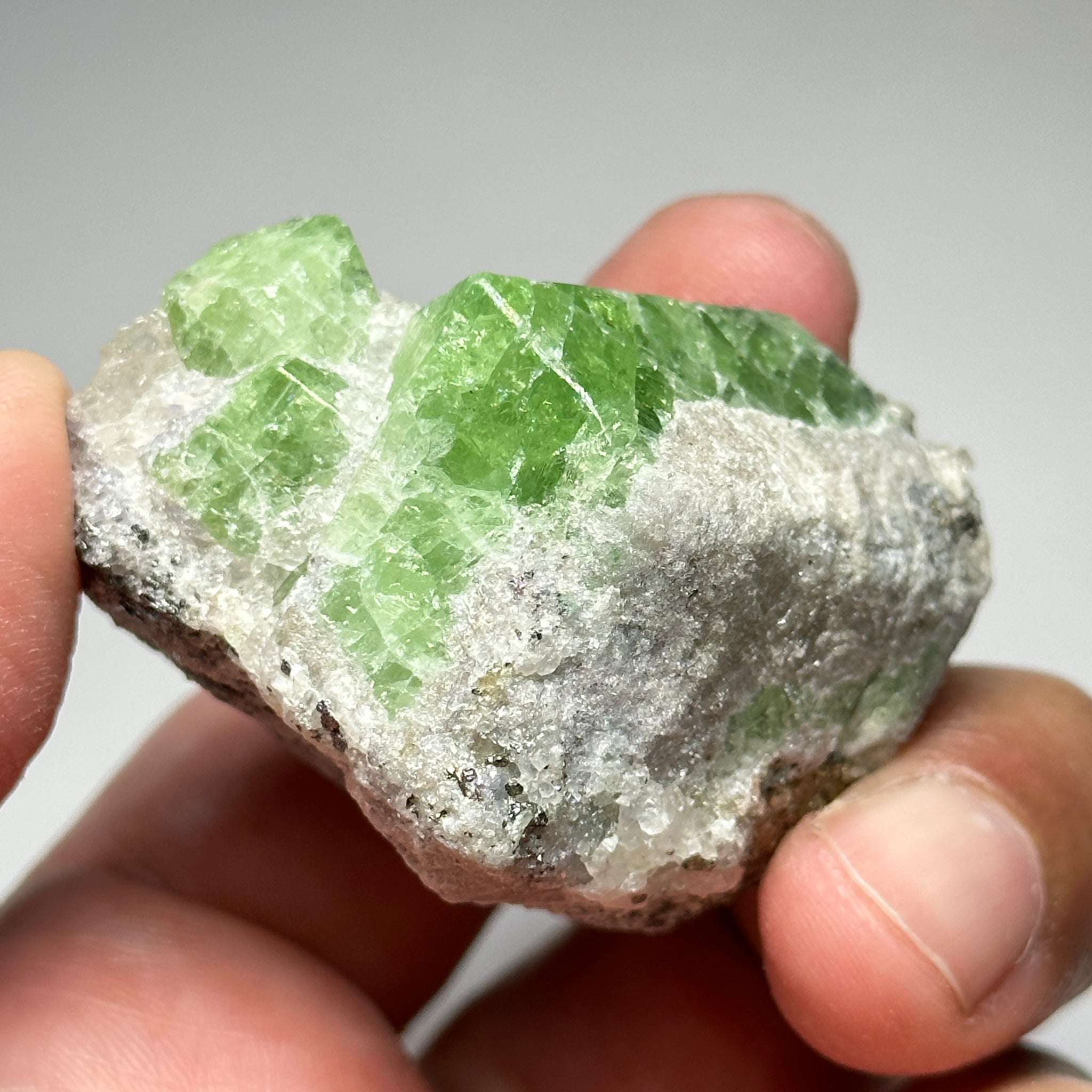Tsavorite Crystal With Tanzanite And Pyrite on Matrix, 84.30gm / 421.50ct, Merelani, Tanzania. 47 x 36 x 39mm Gem portions and sharp point on crystals