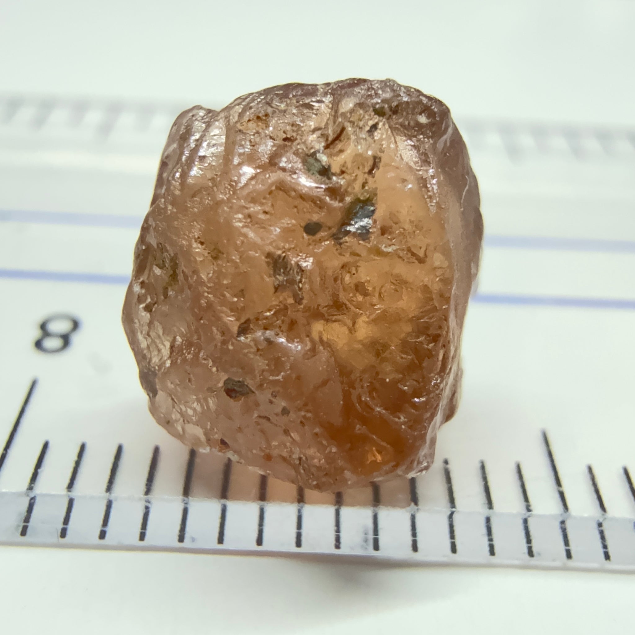 Peach Malaya Garnet, 6.02ct, slight crack 1mm inside from skin, slight gunk on skin on one end needs to be removed on disk, rest slightly silky, Unheated Untreated, Umba Valley Tanzania