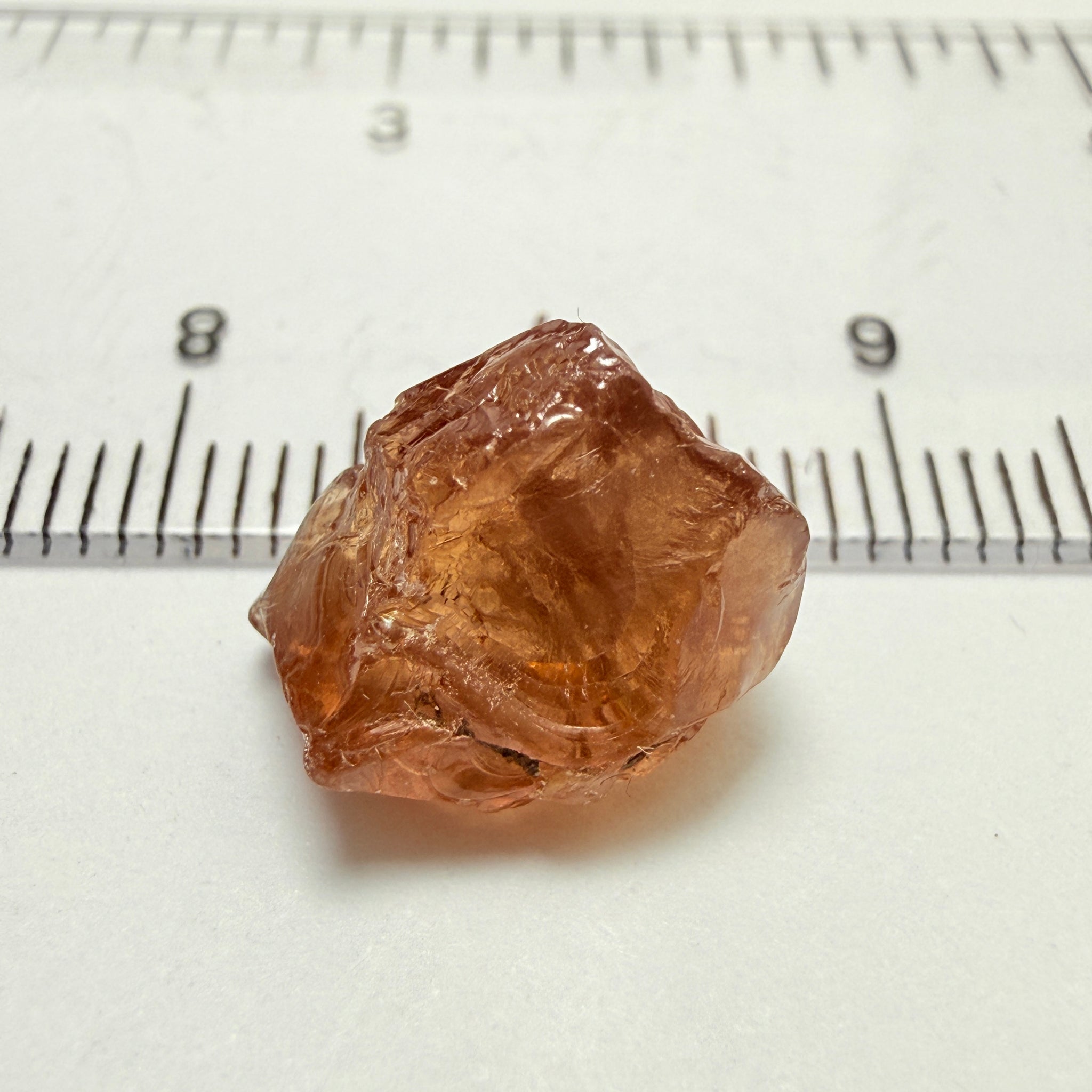 Peach Malaya Garnet, 8.21ct, silk and slight needles but no inclusions, Unheated Untreated, Umba Valley Tanzania, complicated shape.