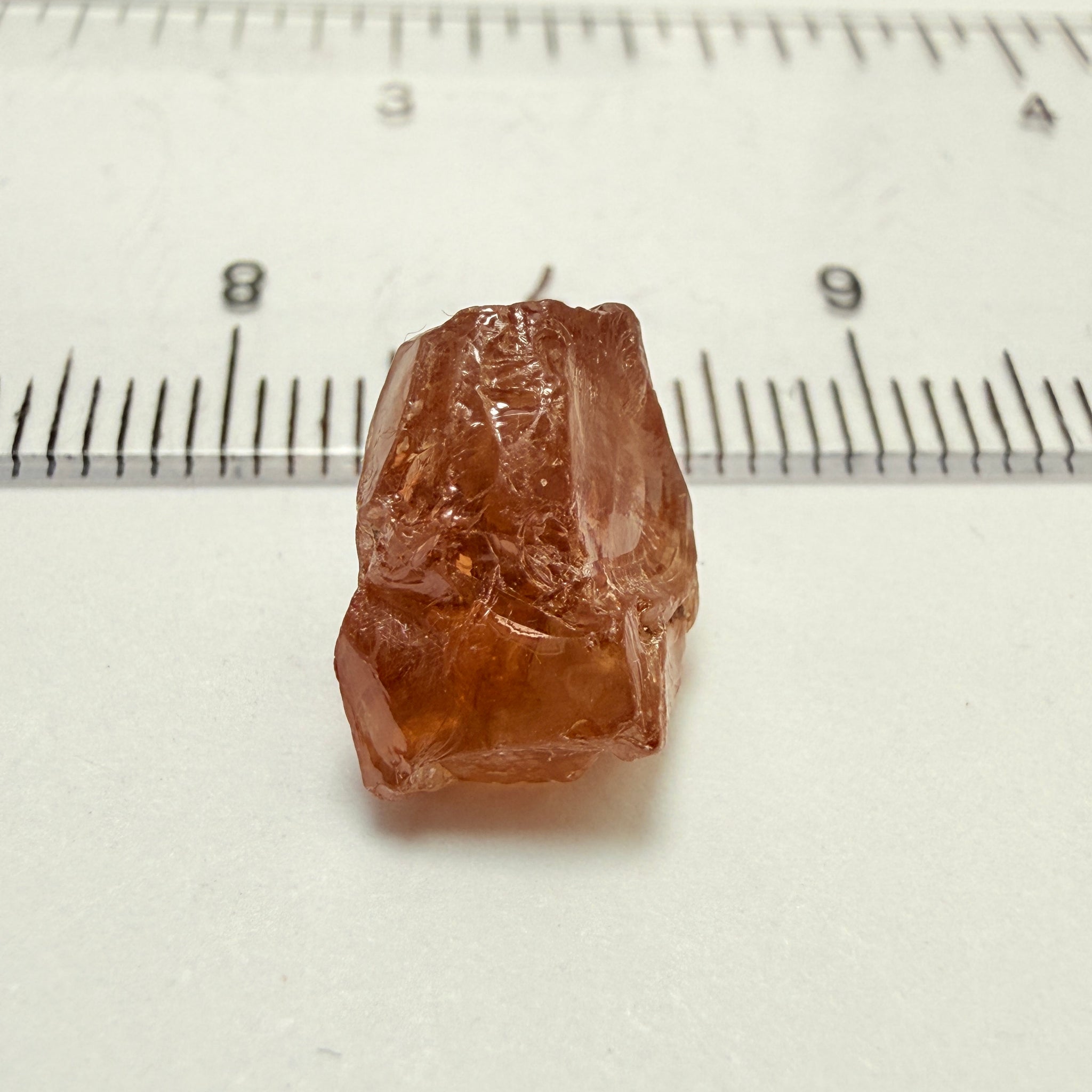 Peach Malaya Garnet, 8.21ct, silk and slight needles but no inclusions, Unheated Untreated, Umba Valley Tanzania, complicated shape.