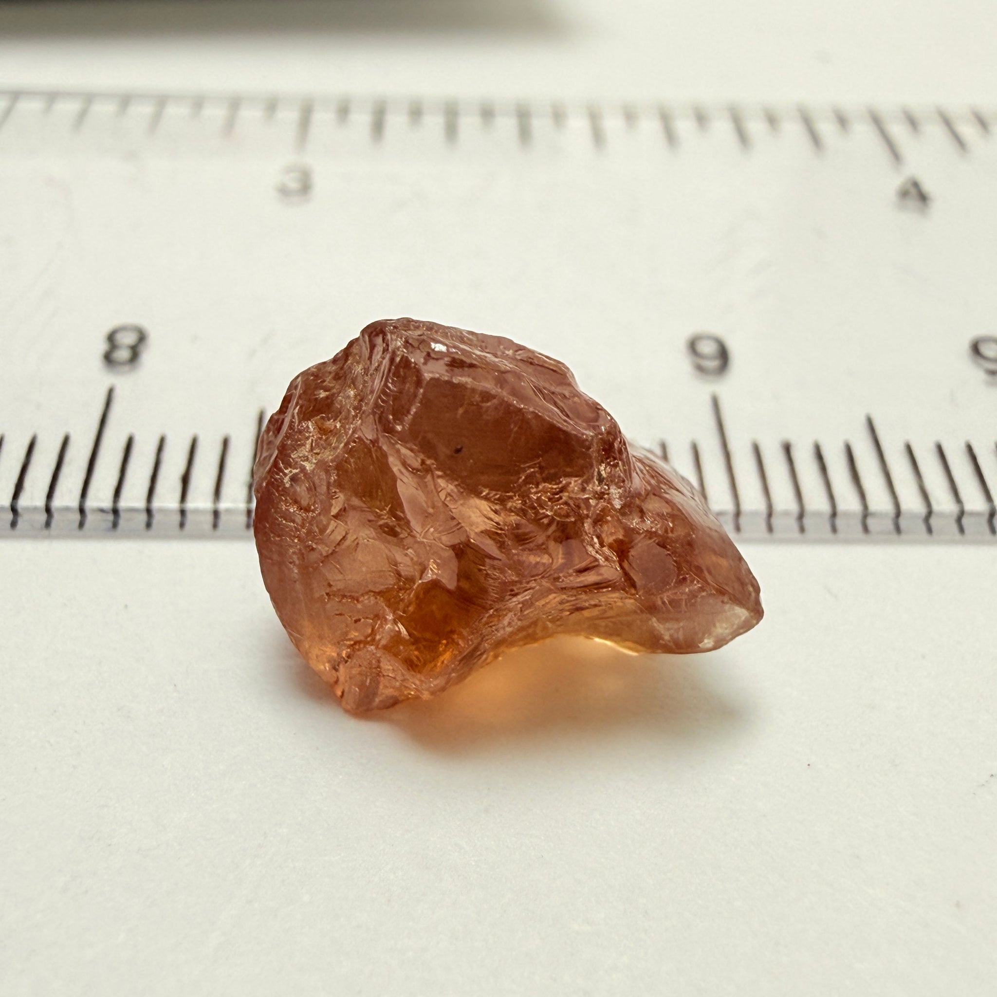 Peach Malaya Garnet, 8.21ct, silk and slight needles but no inclusions, Unheated Untreated, Umba Valley Tanzania, complicated shape.