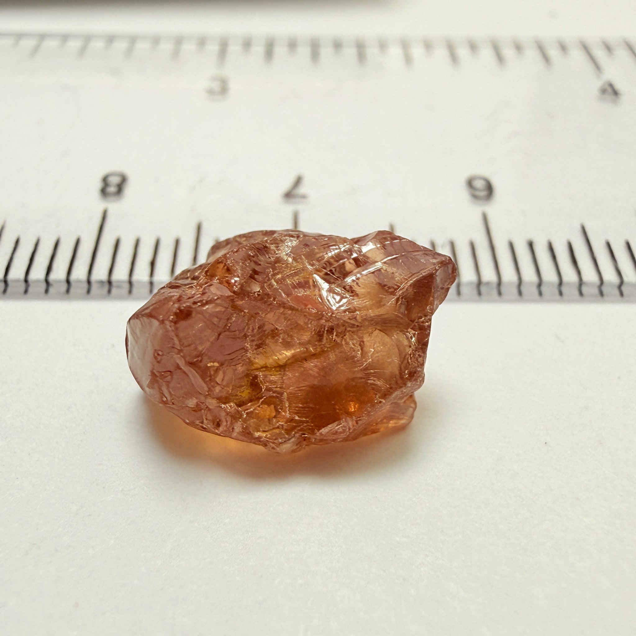 Peach Malaya Garnet, 8.21ct, silk and slight needles but no inclusions, Unheated Untreated, Umba Valley Tanzania, complicated shape.