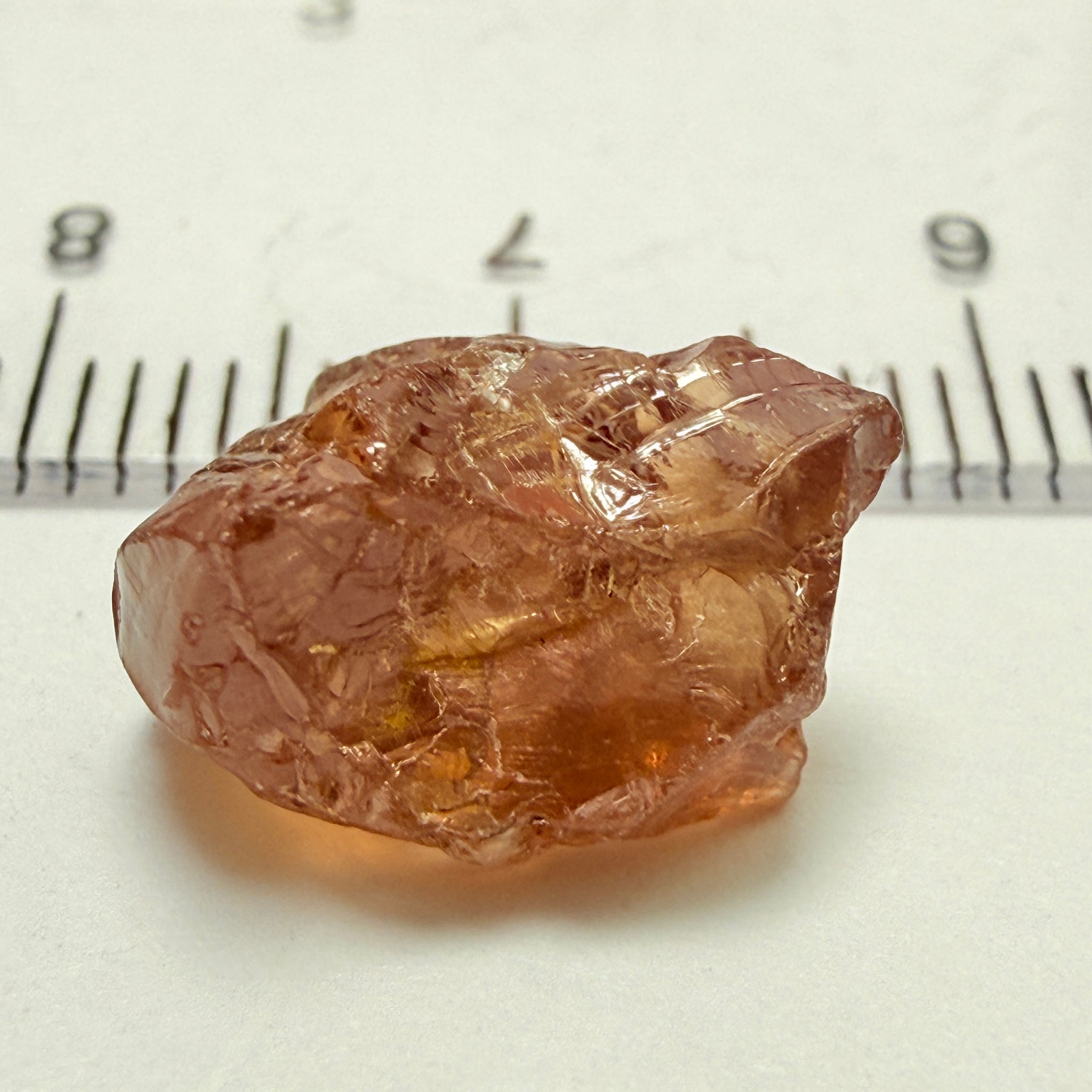 Peach Malaya Garnet, 8.21ct, silk and slight needles but no inclusions, Unheated Untreated, Umba Valley Tanzania, complicated shape.