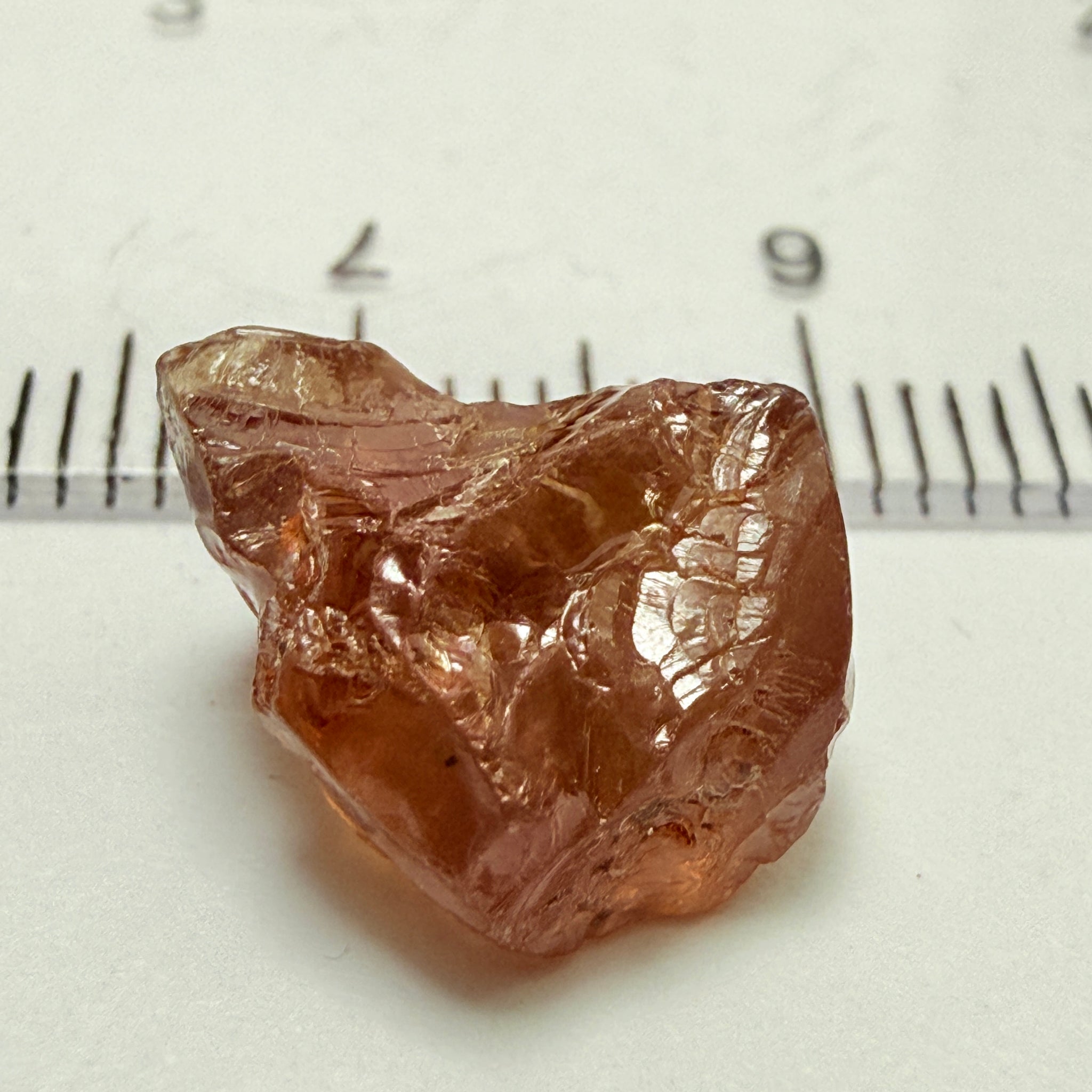 Peach Malaya Garnet, 8.21ct, silk and slight needles but no inclusions, Unheated Untreated, Umba Valley Tanzania, complicated shape.
