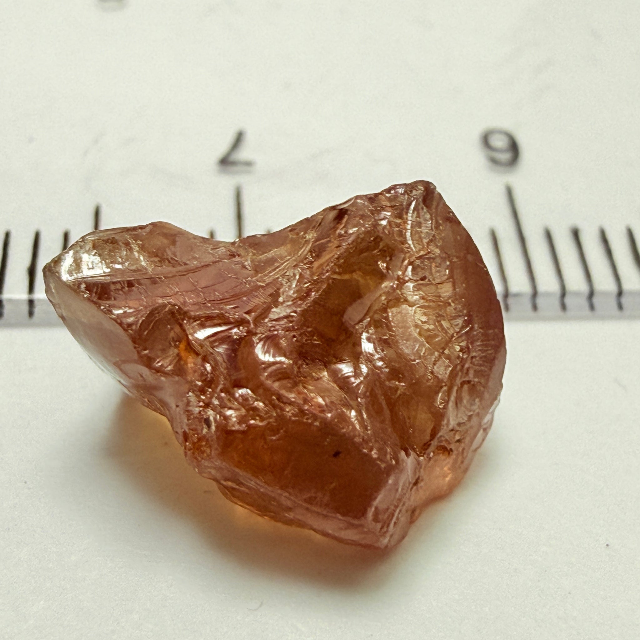 Peach Malaya Garnet, 8.21ct, silk and slight needles but no inclusions, Unheated Untreated, Umba Valley Tanzania, complicated shape.