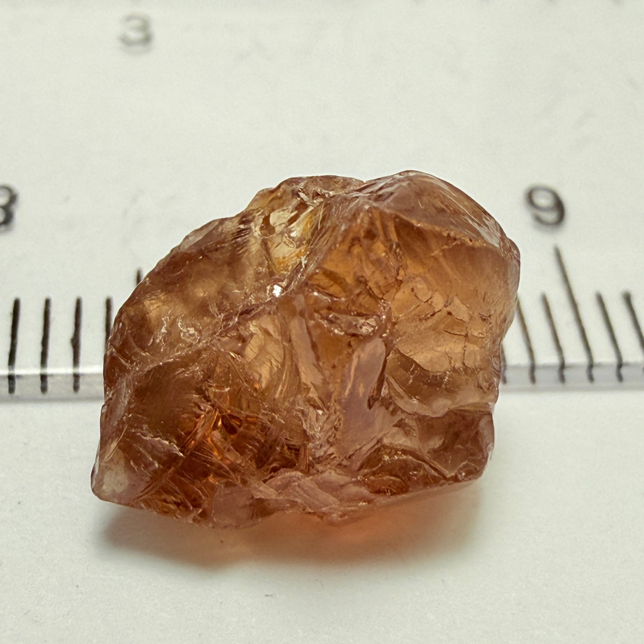 Peach Malaya Garnet, 8.21ct, silk and slight needles but no inclusions, Unheated Untreated, Umba Valley Tanzania, complicated shape.