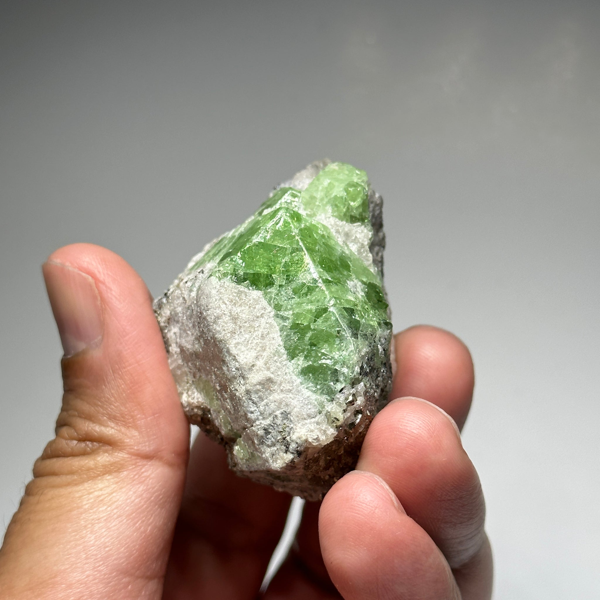 Tsavorite Crystal With Tanzanite And Pyrite on Matrix, 84.30gm / 421.50ct, Merelani, Tanzania. 47 x 36 x 39mm Gem portions and sharp point on crystals