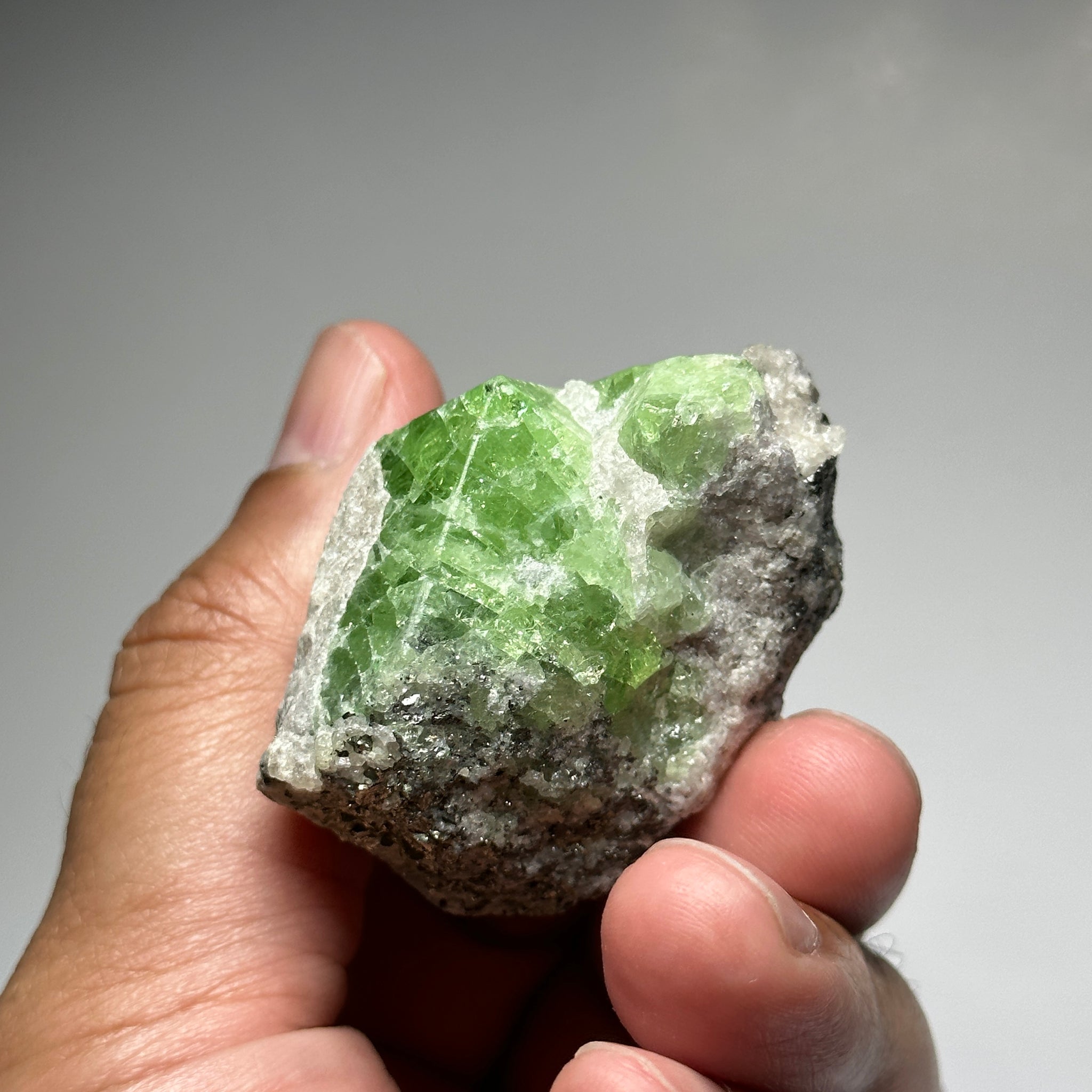 Tsavorite Crystal With Tanzanite And Pyrite on Matrix, 84.30gm / 421.50ct, Merelani, Tanzania. 47 x 36 x 39mm Gem portions and sharp point on crystals