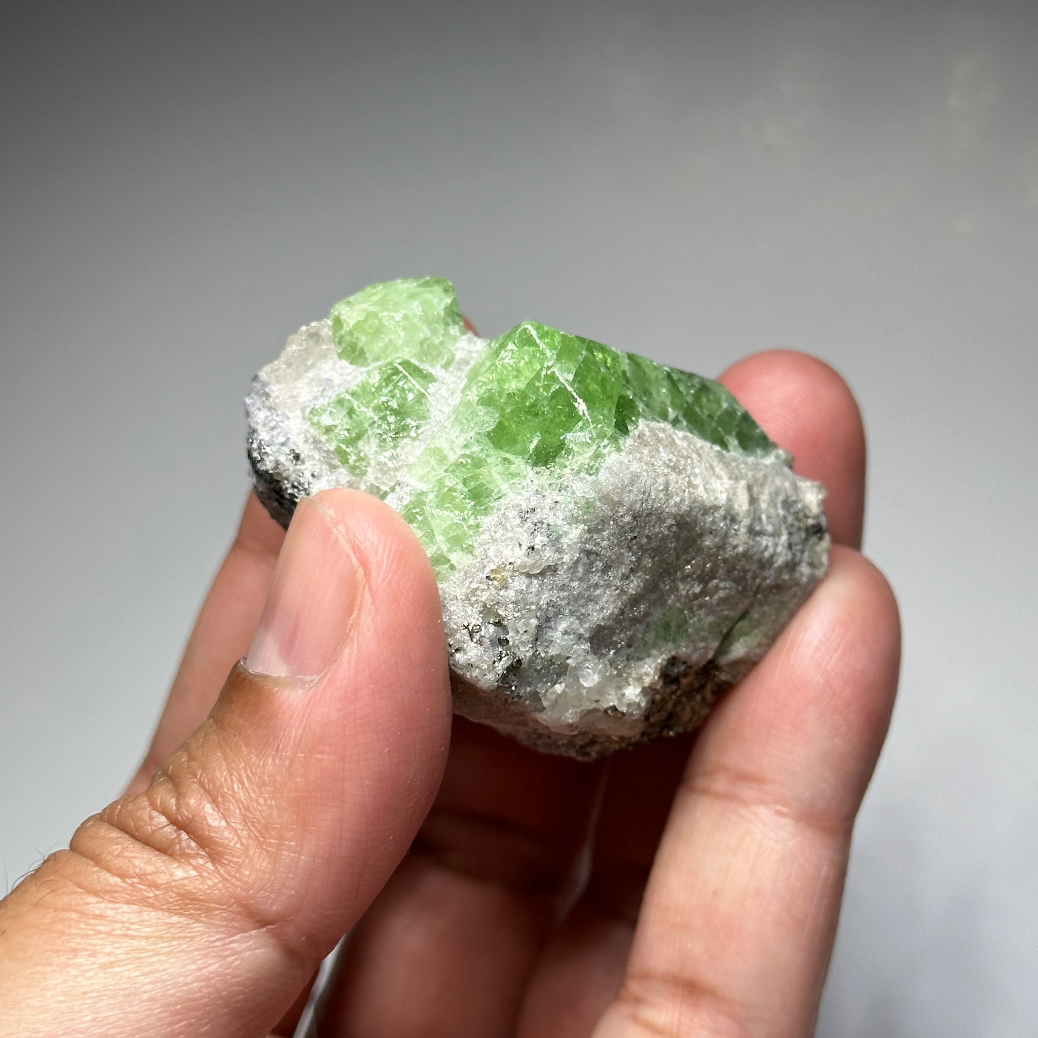 Tsavorite Crystal With Tanzanite And Pyrite on Matrix, 84.30gm / 421.50ct, Merelani, Tanzania. 47 x 36 x 39mm Gem portions and sharp point on crystals