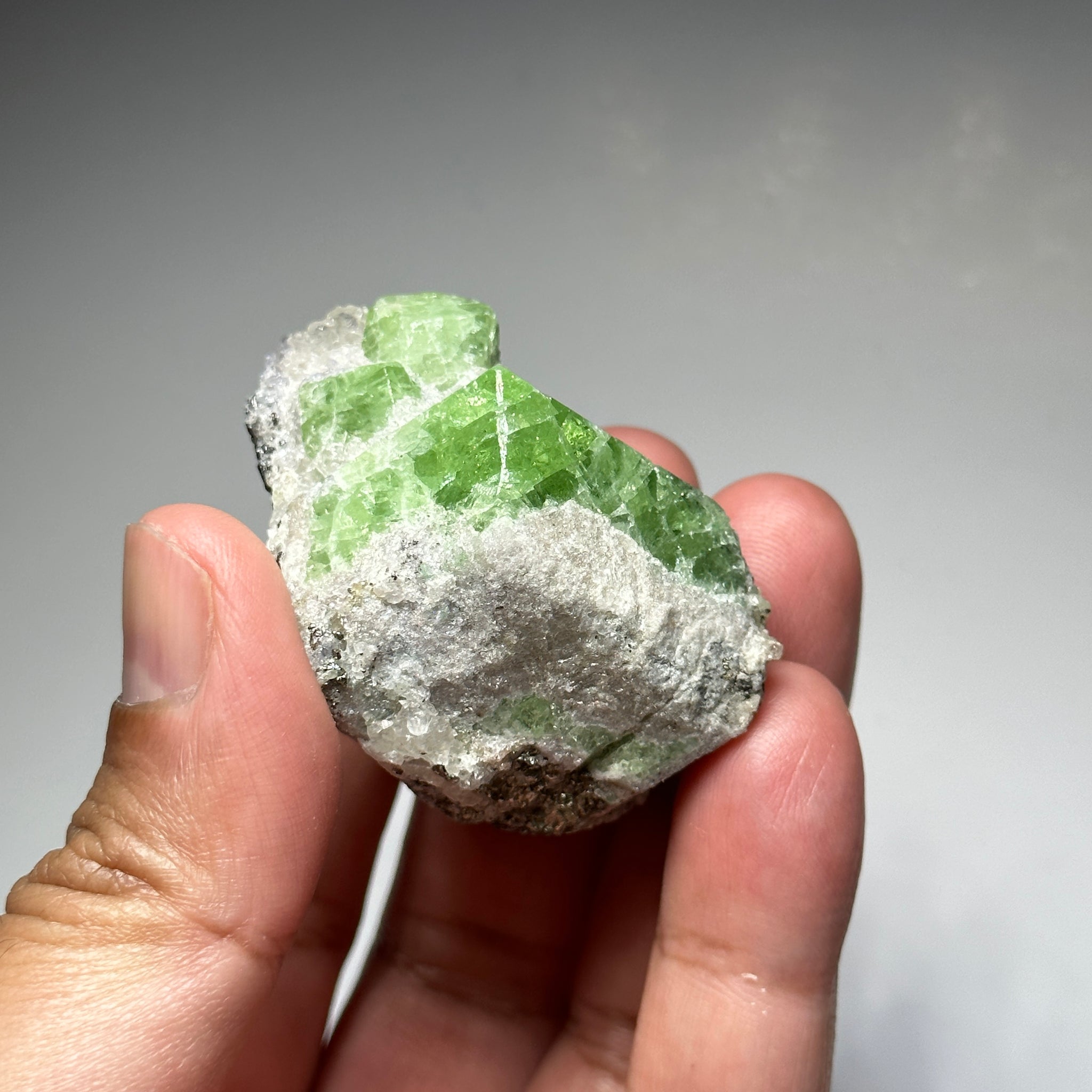 Tsavorite Crystal With Tanzanite And Pyrite on Matrix, 84.30gm / 421.50ct, Merelani, Tanzania. 47 x 36 x 39mm Gem portions and sharp point on crystals