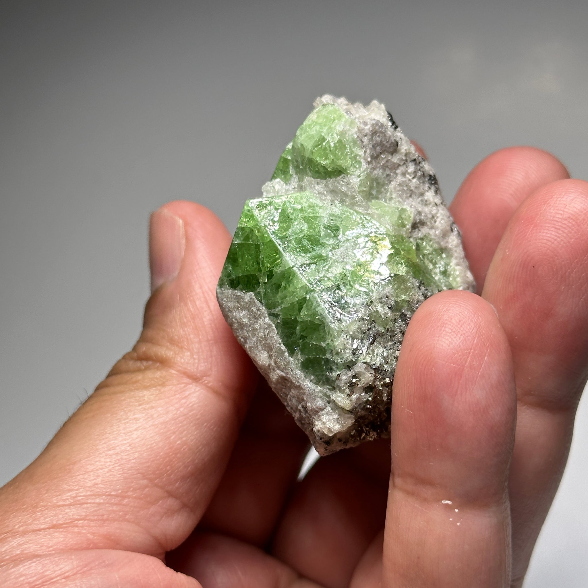 Tsavorite Crystal With Tanzanite And Pyrite on Matrix, 84.30gm / 421.50ct, Merelani, Tanzania. 47 x 36 x 39mm Gem portions and sharp point on crystals