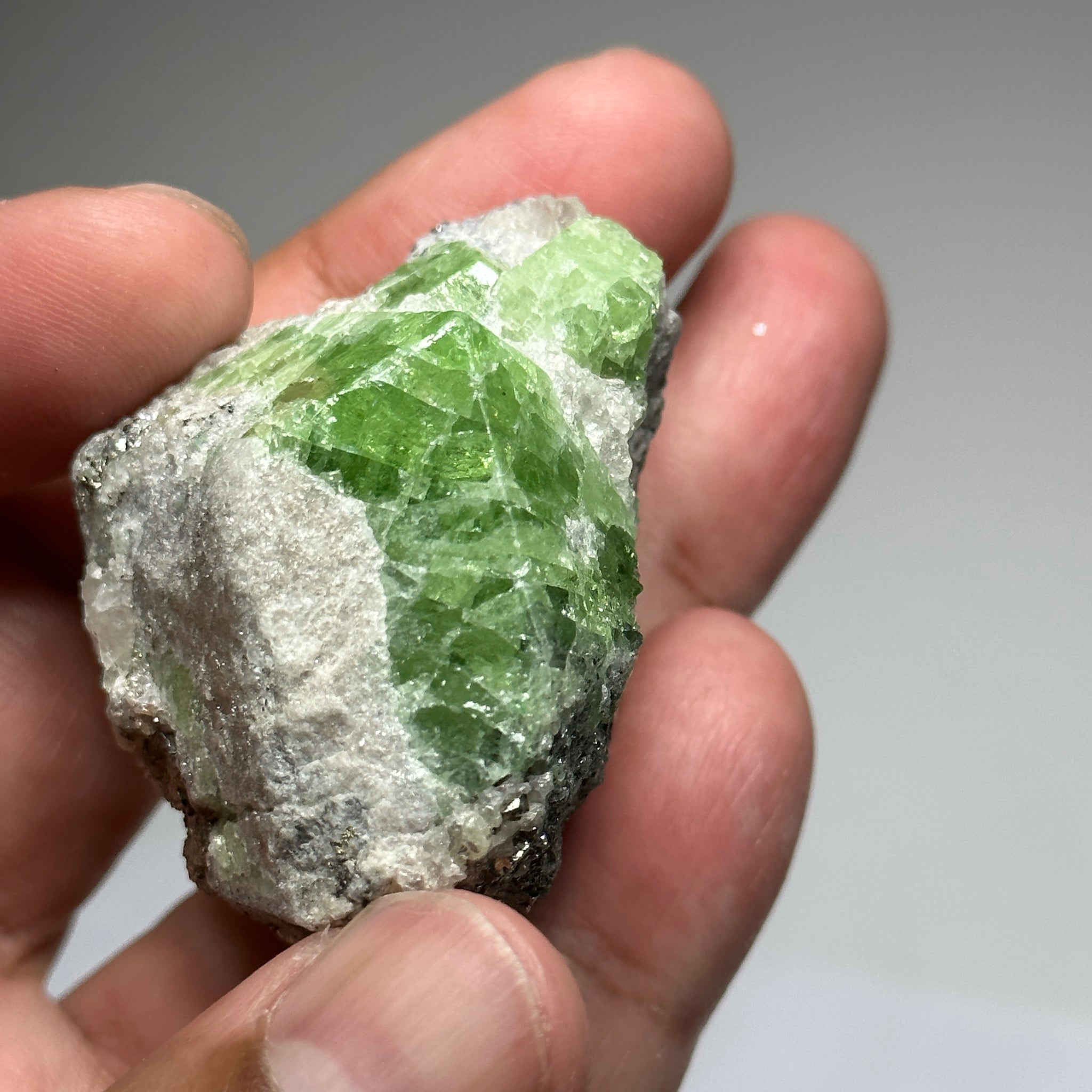 Tsavorite Crystal With Tanzanite And Pyrite on Matrix, 84.30gm / 421.50ct, Merelani, Tanzania. 47 x 36 x 39mm Gem portions and sharp point on crystals