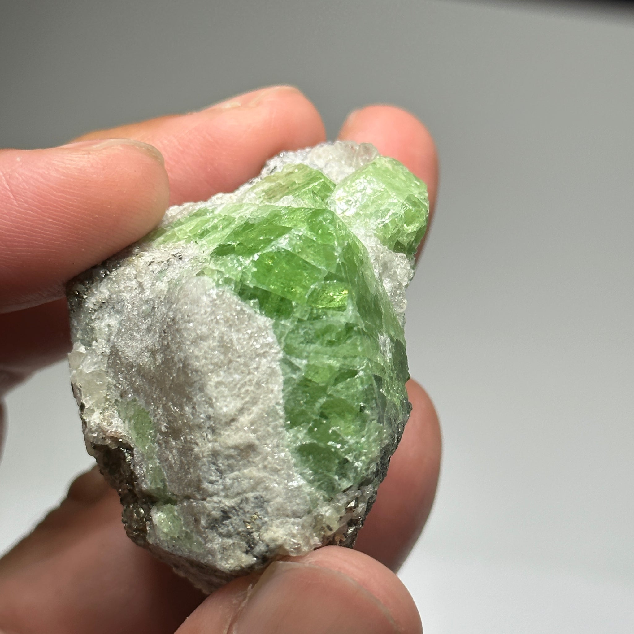 Tsavorite Crystal With Tanzanite And Pyrite on Matrix, 84.30gm / 421.50ct, Merelani, Tanzania. 47 x 36 x 39mm Gem portions and sharp point on crystals