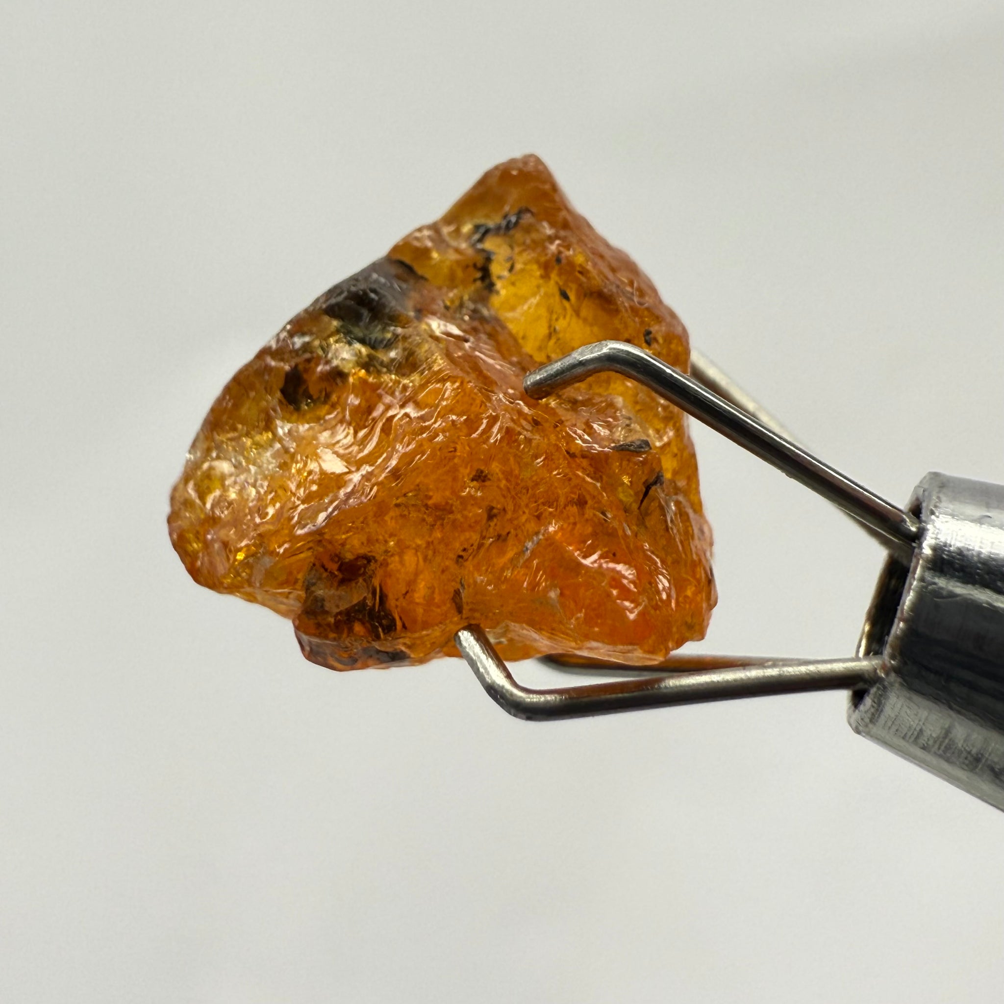 Mandarin Spessartite Garnet, 4.86ct, Loliondo, Tanzania, Untreated Unheated, shape is flattish, heavily included, see pictures for inclusion locations, and if it’s ok it’s priced really well
