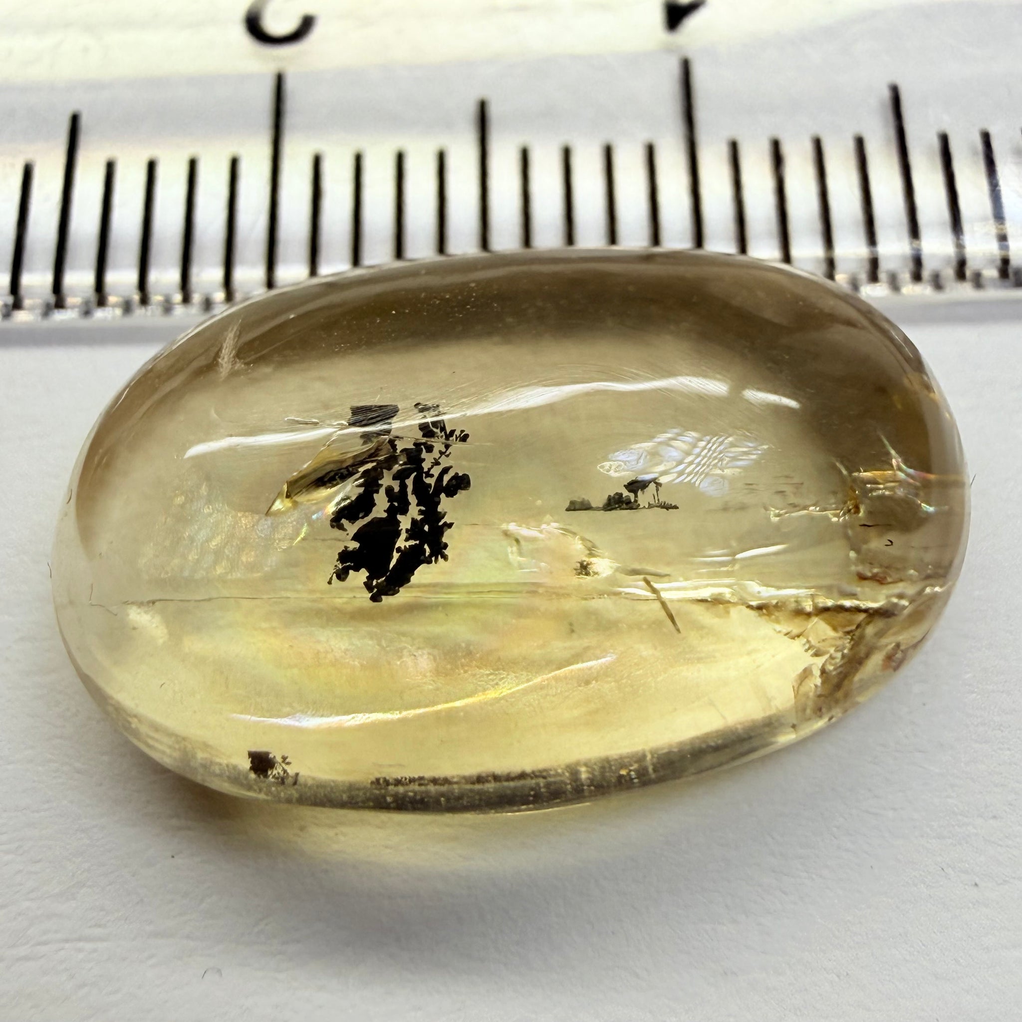 Golden Scapolite Cabochon with a dendrite, and a halo forming around the dendrite from a fracture, 11.53ct, Tanzania, Untreated Unheated