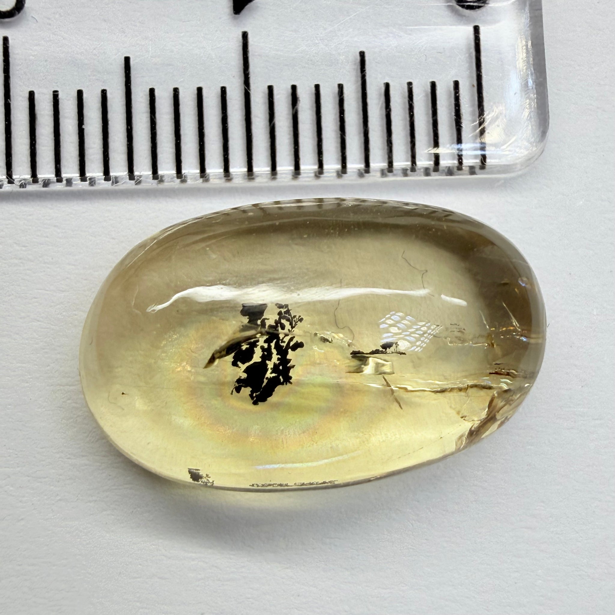 Golden Scapolite Cabochon with a dendrite, and a halo forming around the dendrite from a fracture, 11.53ct, Tanzania, Untreated Unheated