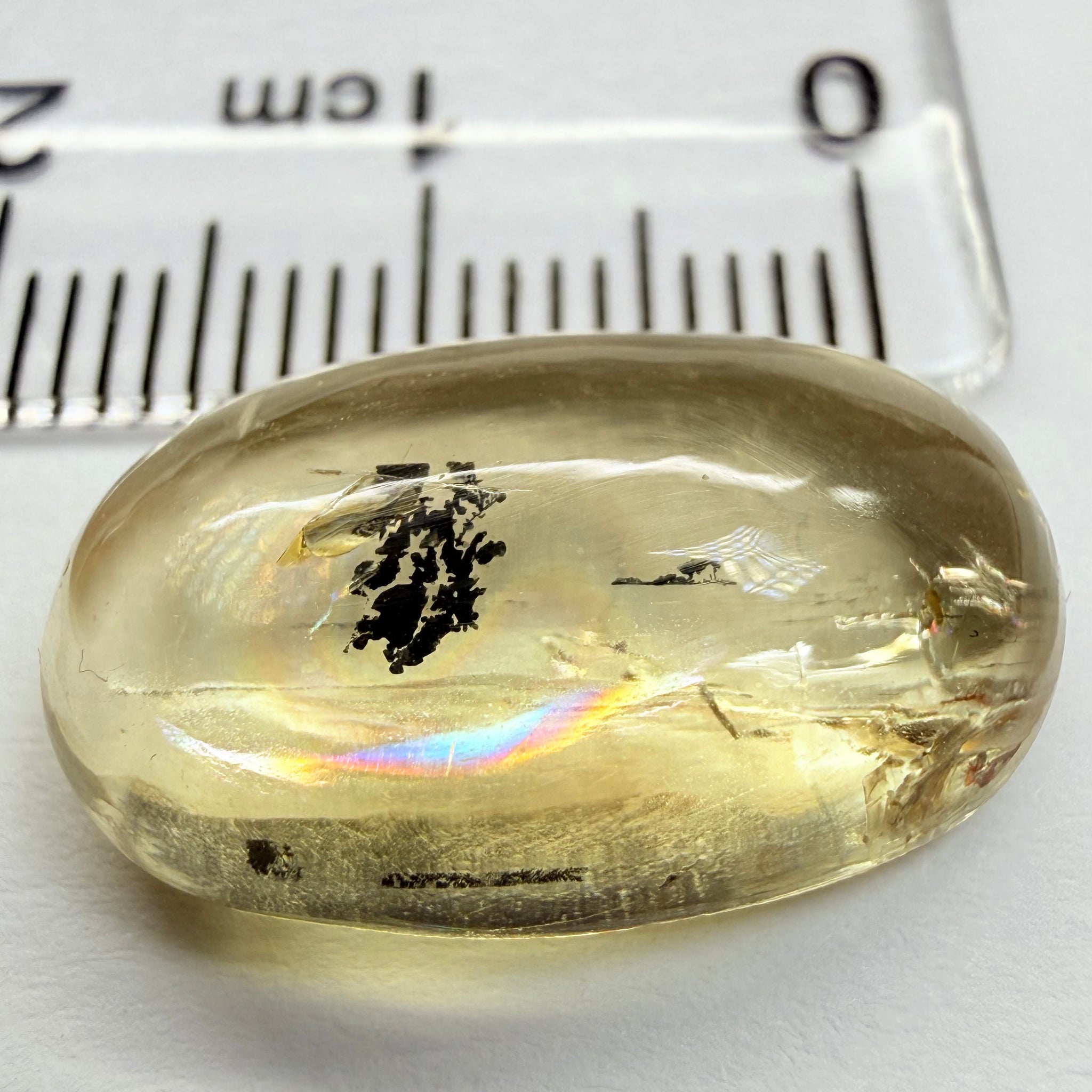 Golden Scapolite Cabochon with a dendrite, and a halo forming around the dendrite from a fracture, 11.53ct, Tanzania, Untreated Unheated