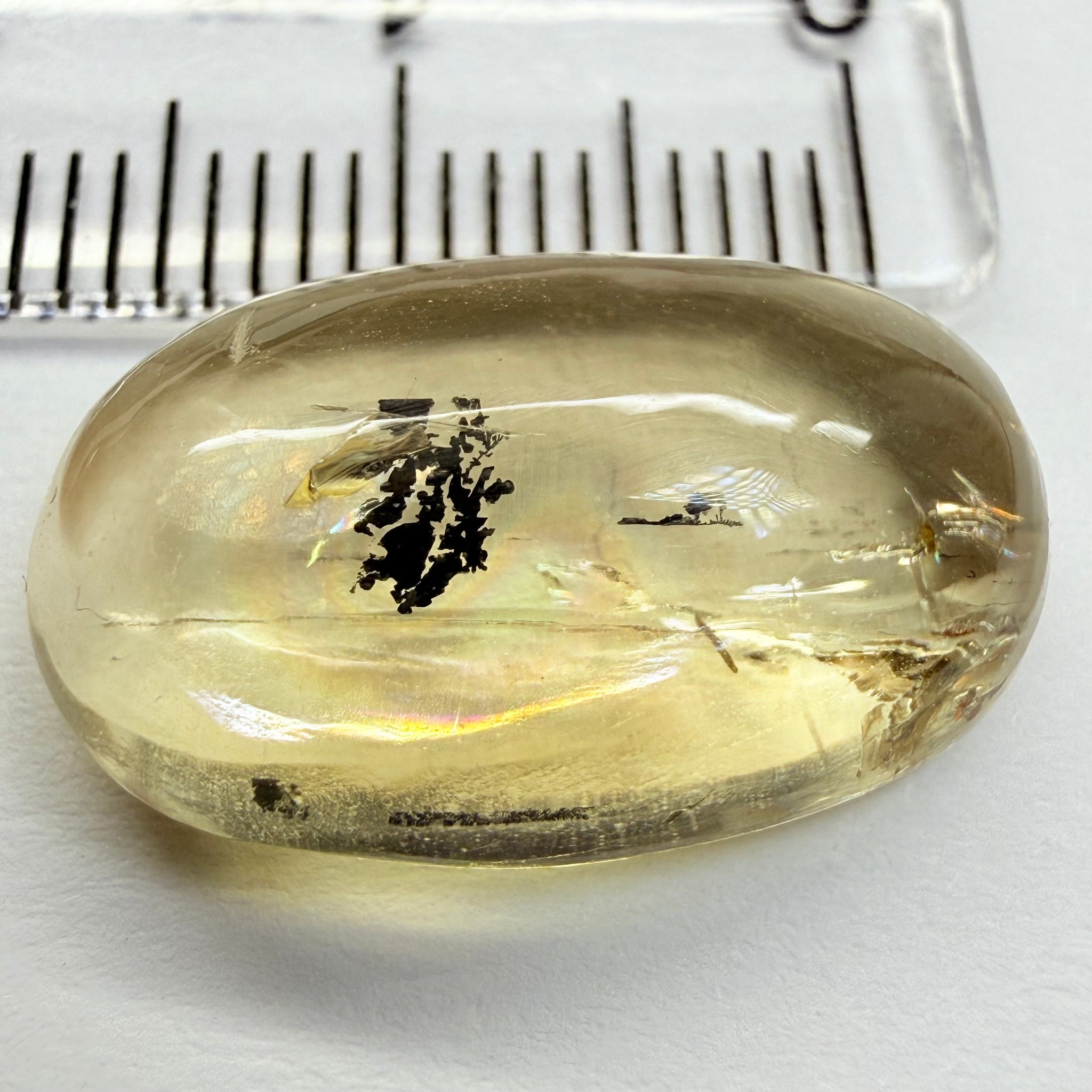 Golden Scapolite Cabochon with a dendrite, and a halo forming around the dendrite from a fracture, 11.53ct, Tanzania, Untreated Unheated